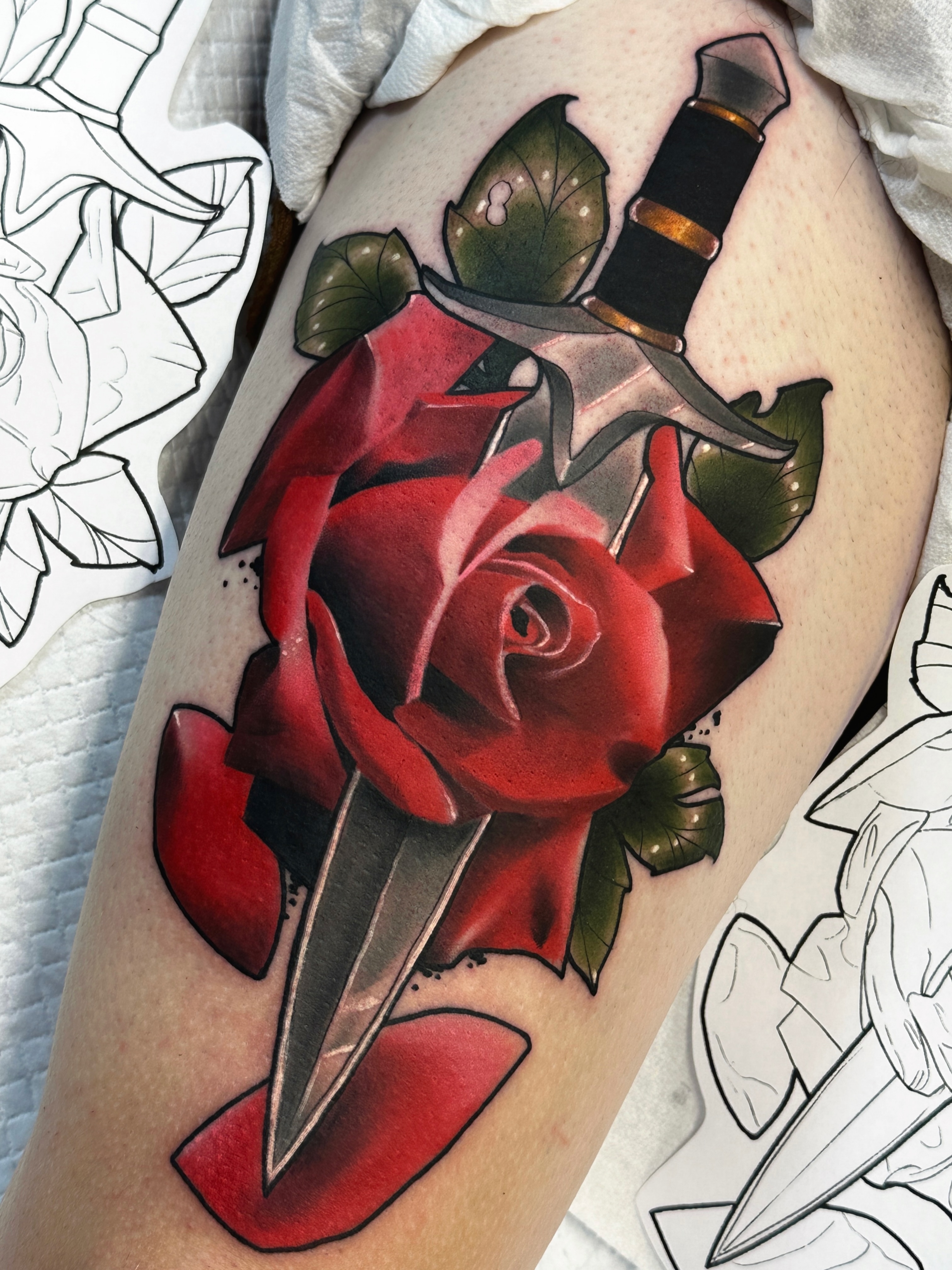 Red rose and dagger American traditional tattoo on the thigh by 🍃  𝑳𝒆𝒆 𝑴𝒖𝒍𝒍𝒆𝒏  🍂, Seattle, Washington