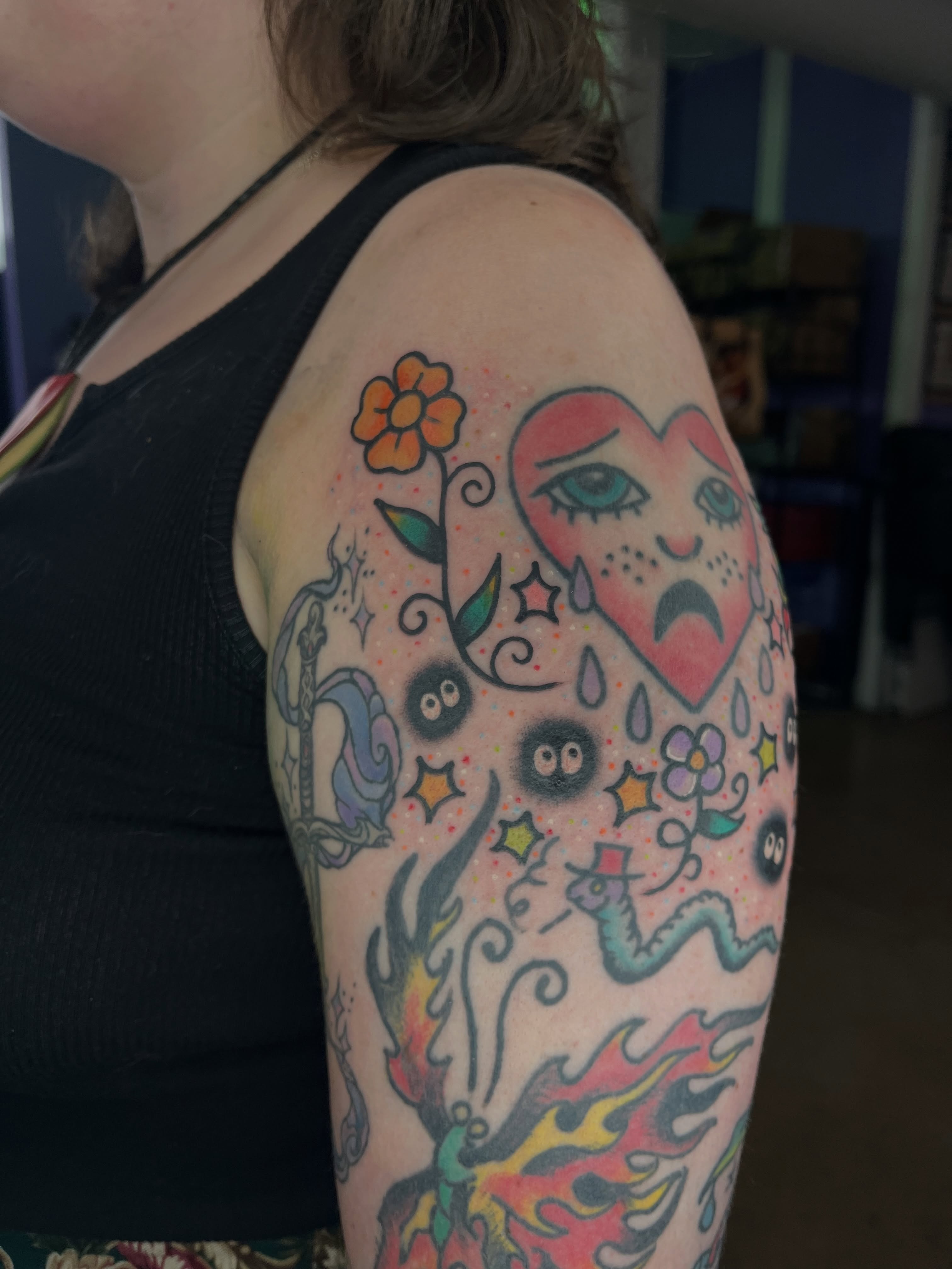 Heart with eyes American traditional tattoo on the upper arm by Autumn**🍓NOW BOOKING
