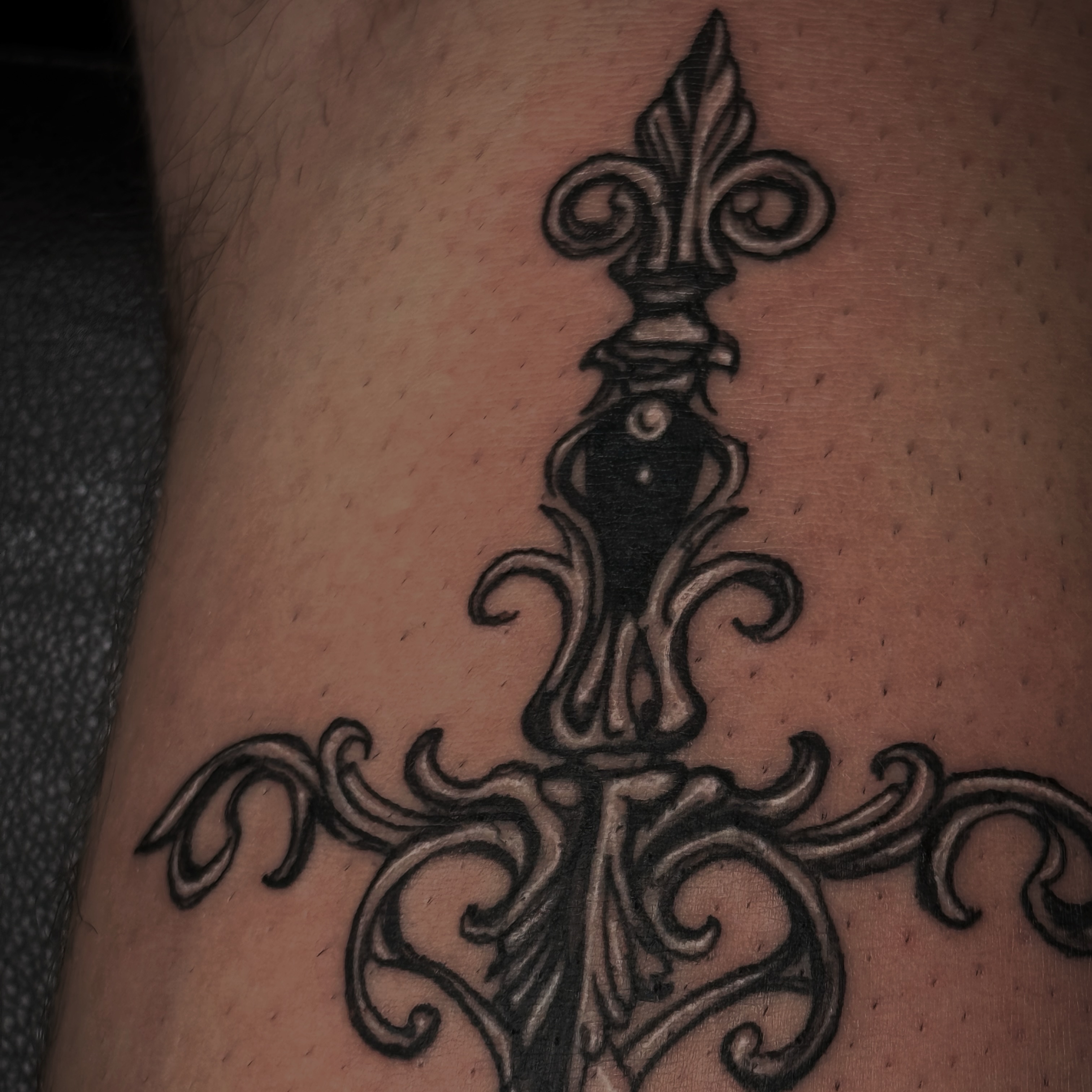 Fleur-de-lis ornamental tattoo on the forearm by Kaylee Castleton, Tooele, Utah