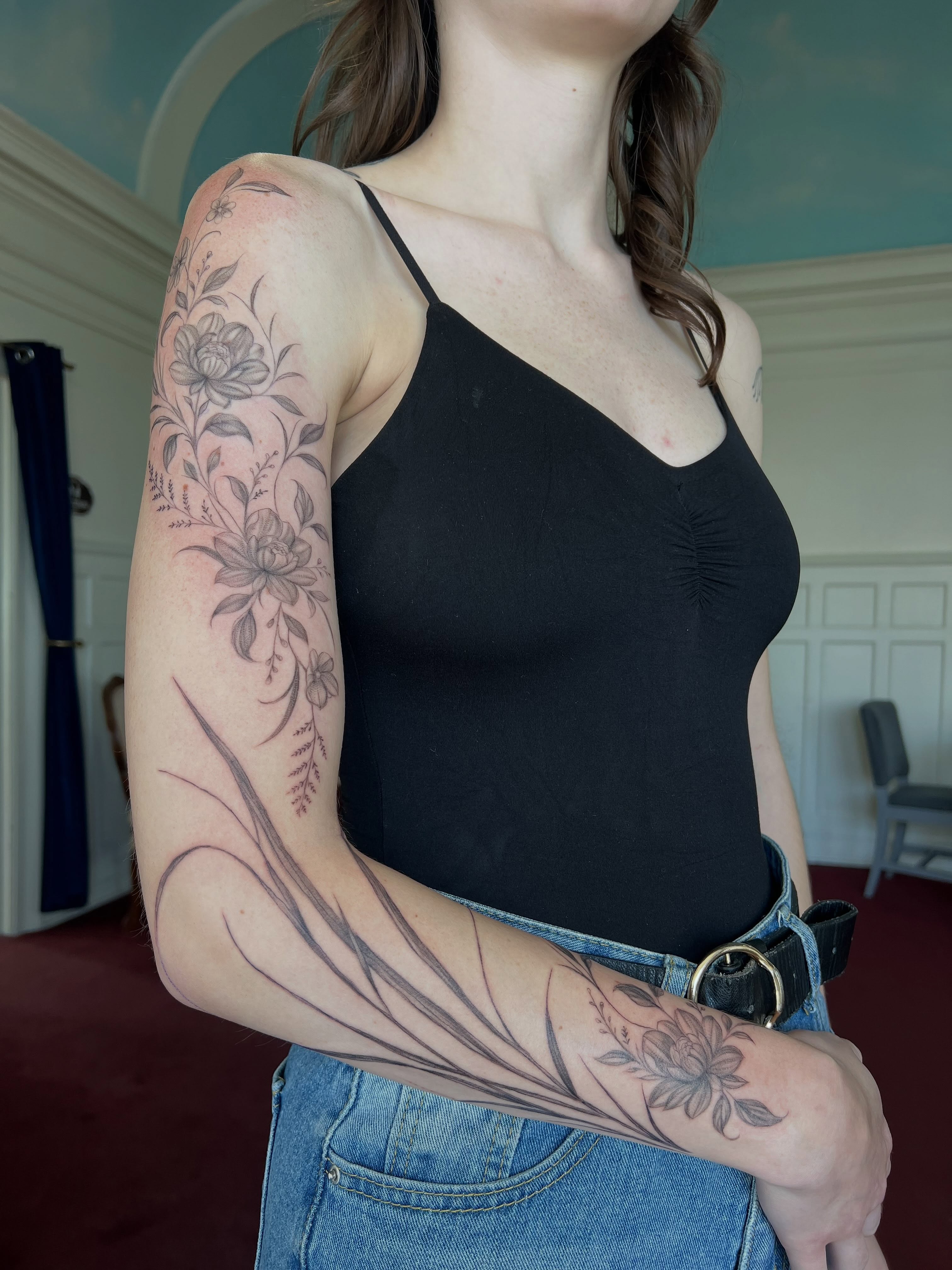 Floral design black and grey tattoo on the upper arm by Jordi WA Tacoma Tattooer