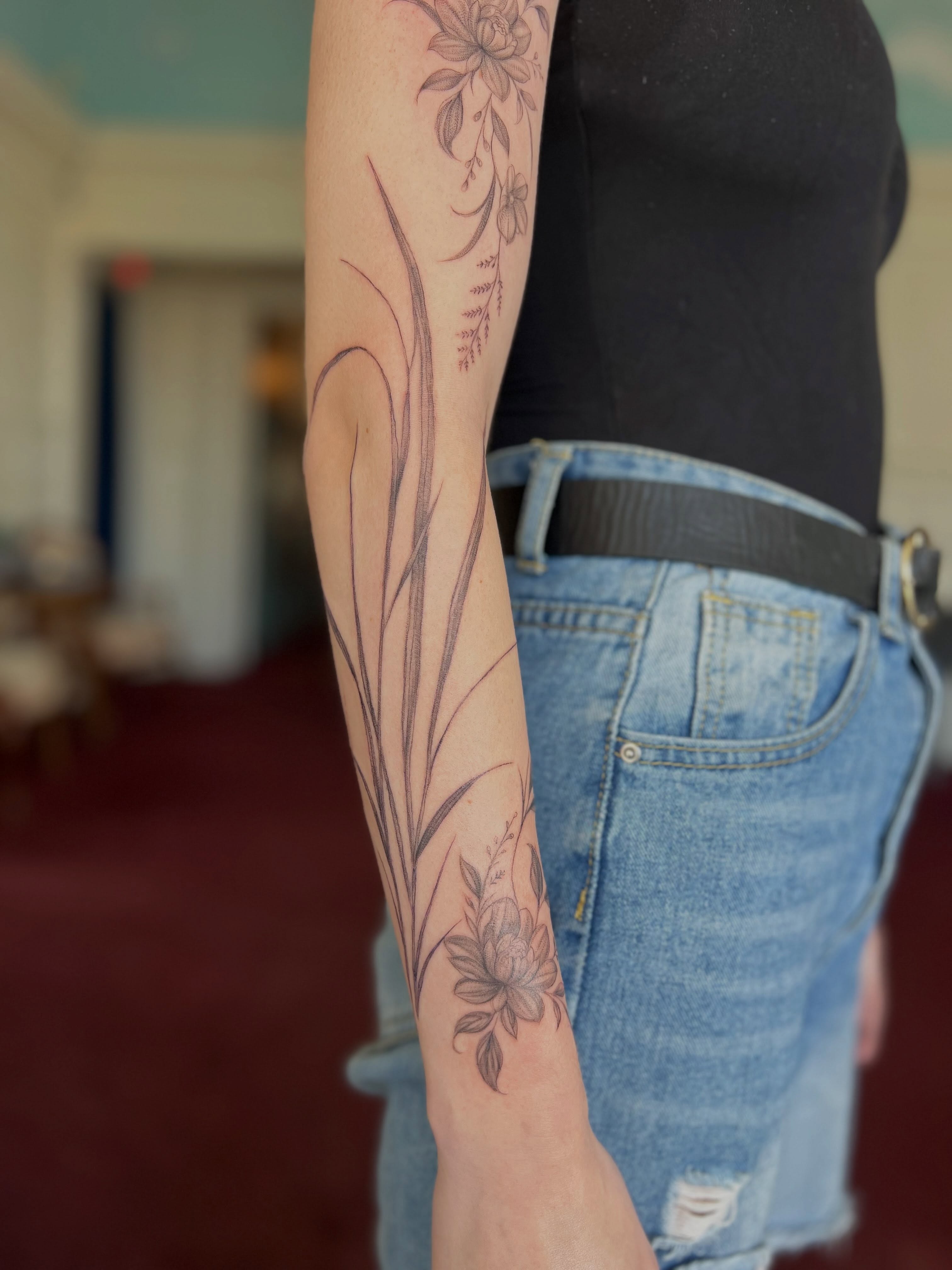 Floral design black and grey tattoo on the forearm by Jordi WA Tacoma Tattooer