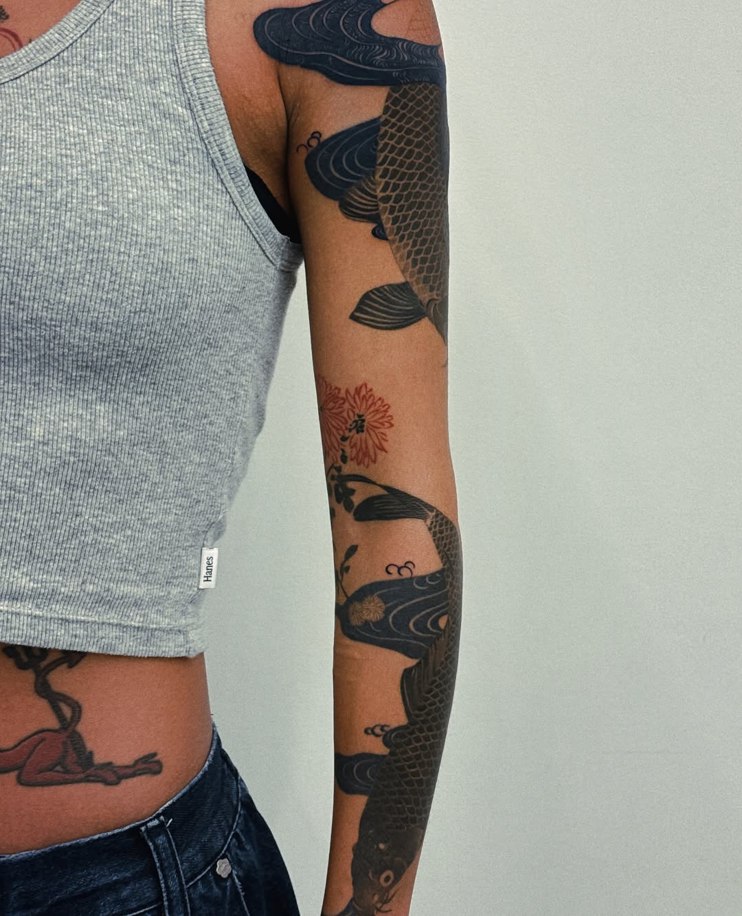 Koi fish and flowers japanese irezumi tattoo on the upper arm by 비단, New York, New York