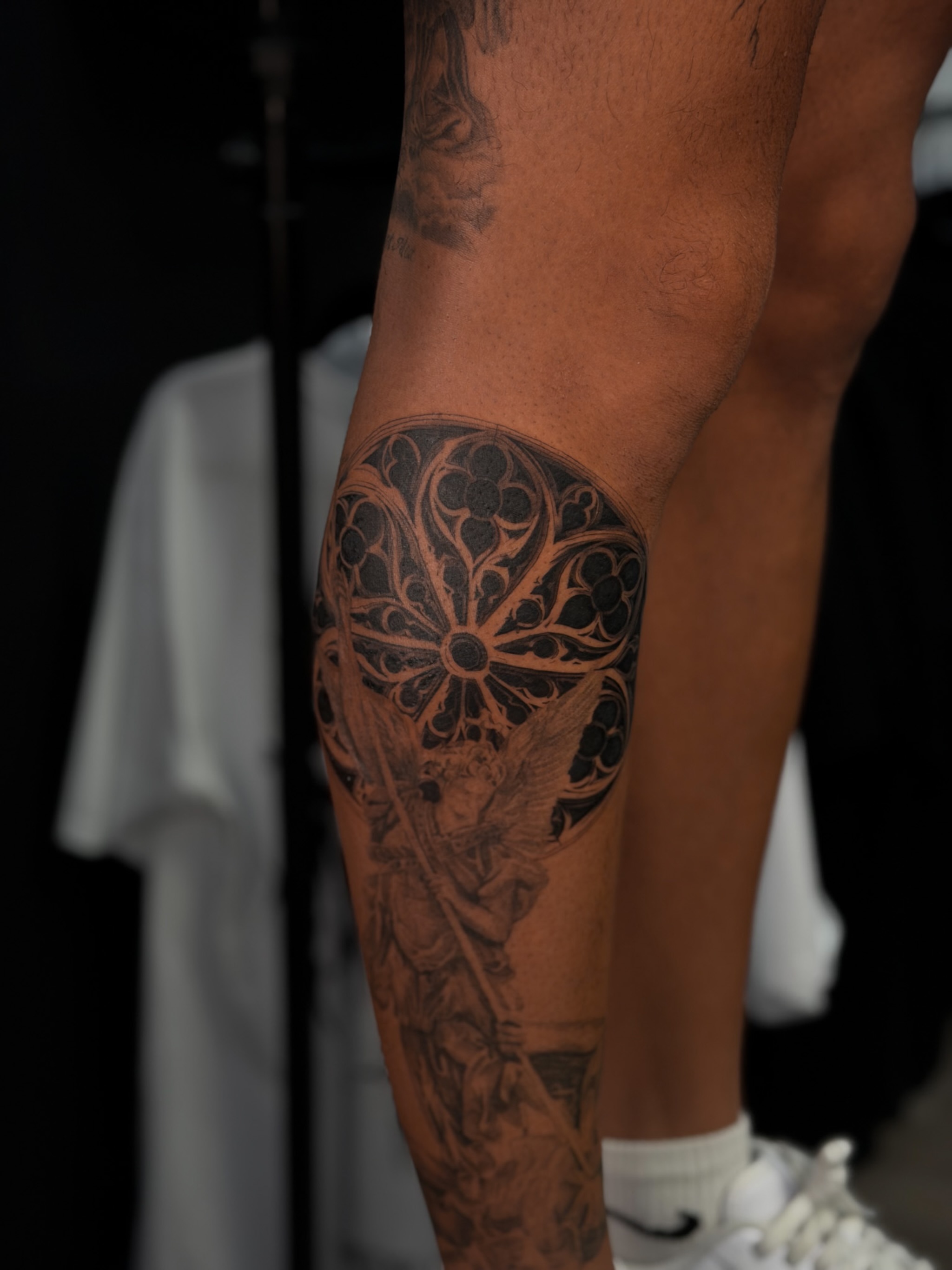 Religious angel geometric tattoo on the leg by Elijah Cosme, Miami, Florida