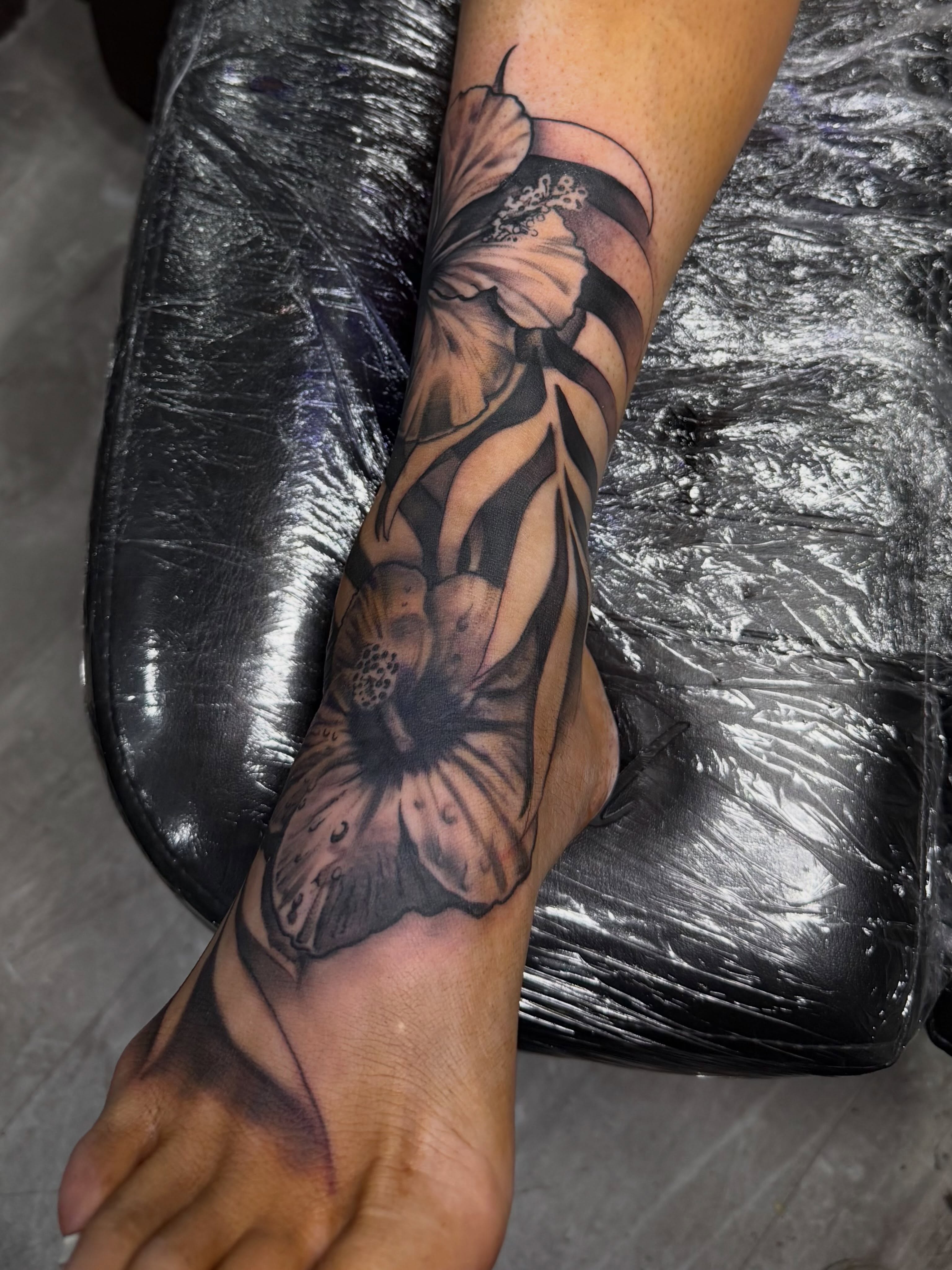Flower black and grey tattoo on the forearm by Lu Ve, Dayton, Ohio