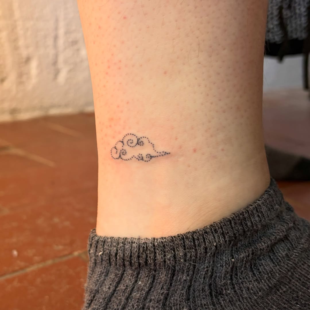 Cloud dotwork tattoo on the forearm by kari