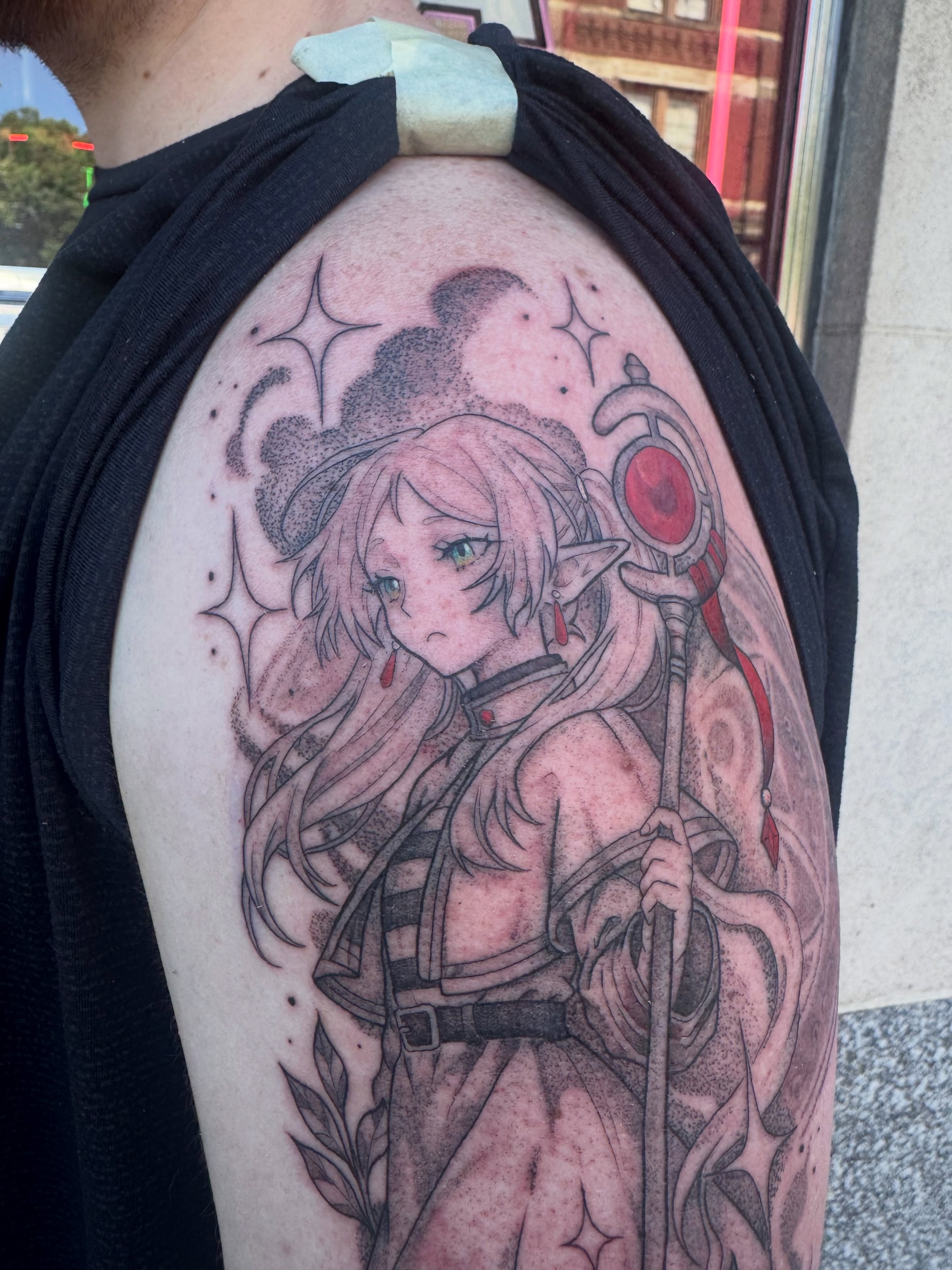 Elf character anime tattoo on the shoulder by Kylie Allen