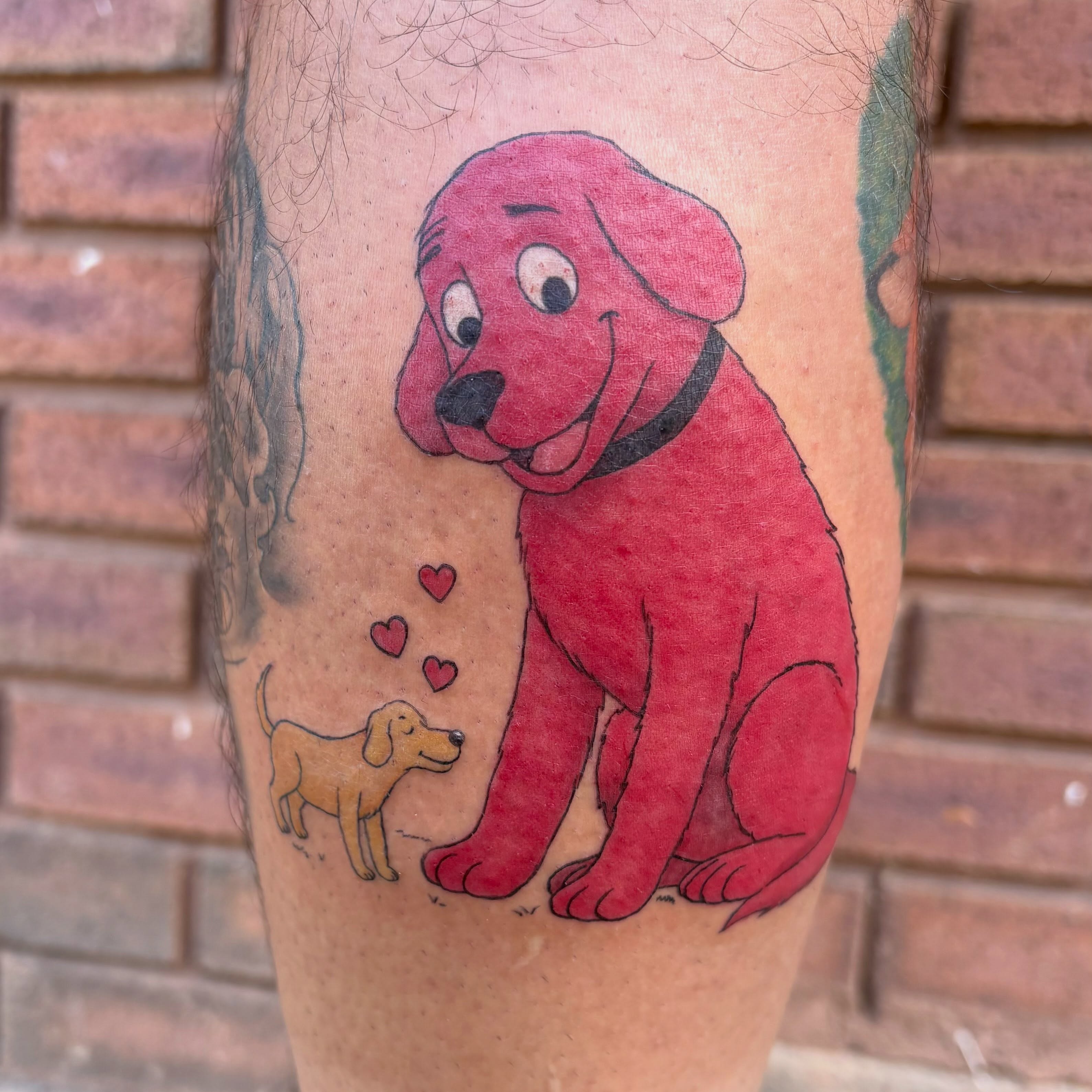Clifford the Big Red Dog illustrative tattoo on the leg by Sierra Maynard