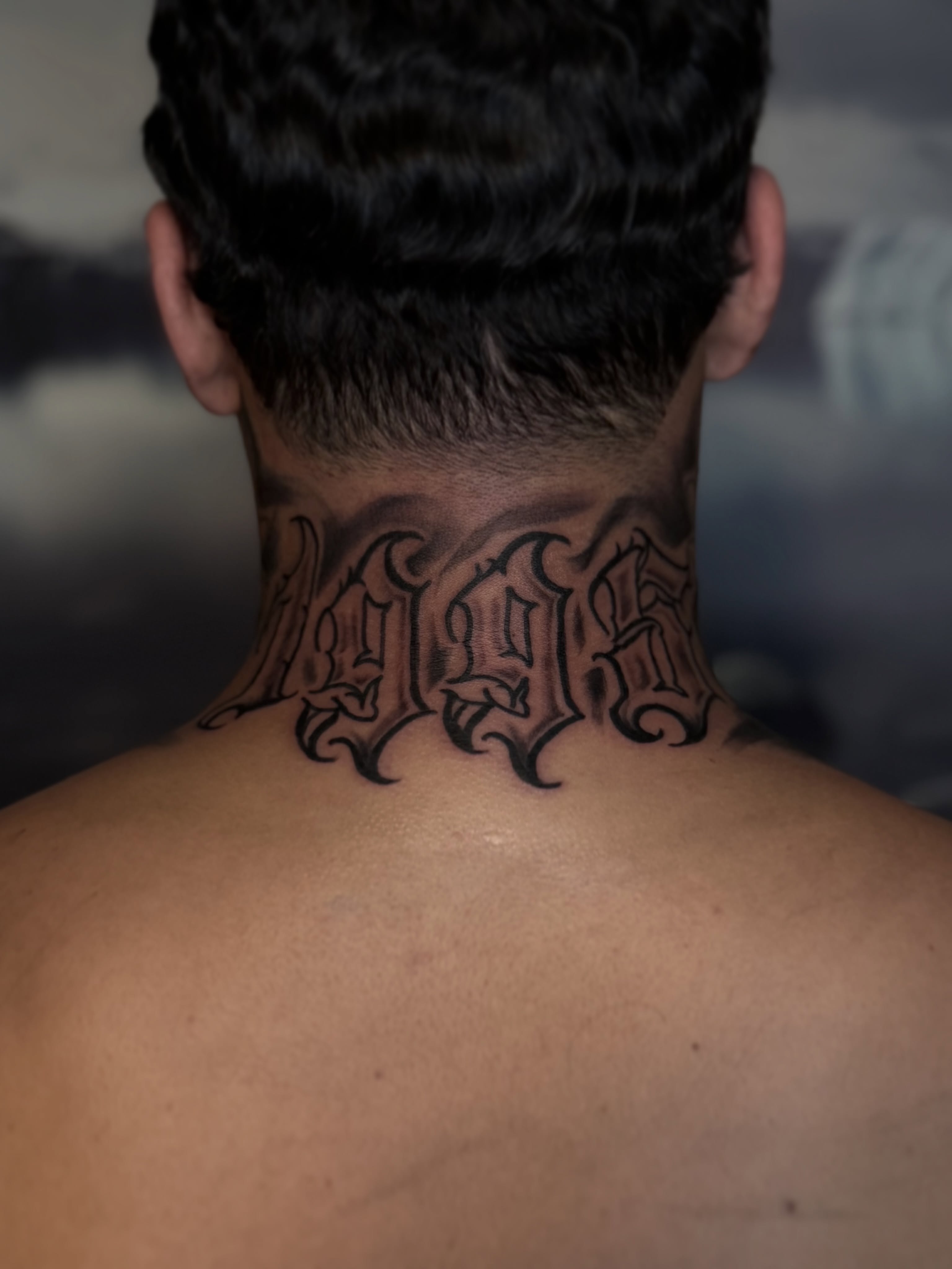 Script lettering lettering script tattoo on the neck by Messias Tattoo Artist