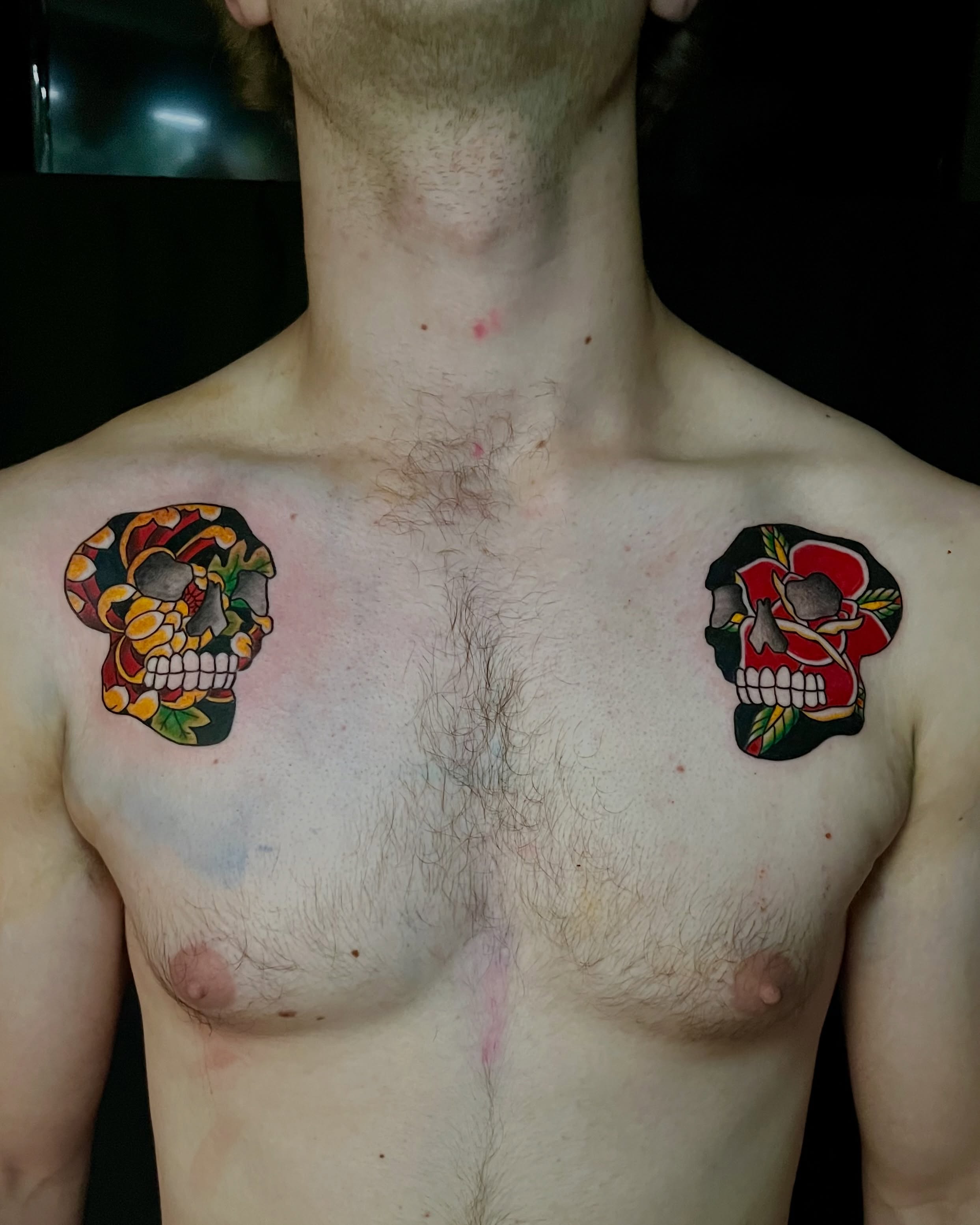 Skulls American traditional tattoo on the chest by EO, Chicago, Illinois