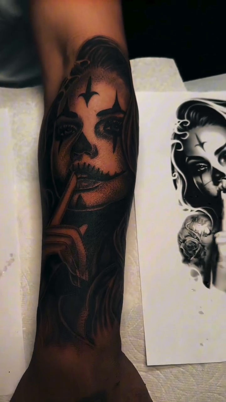 Woman with clown makeup dark realism tattoo by Nate Webb