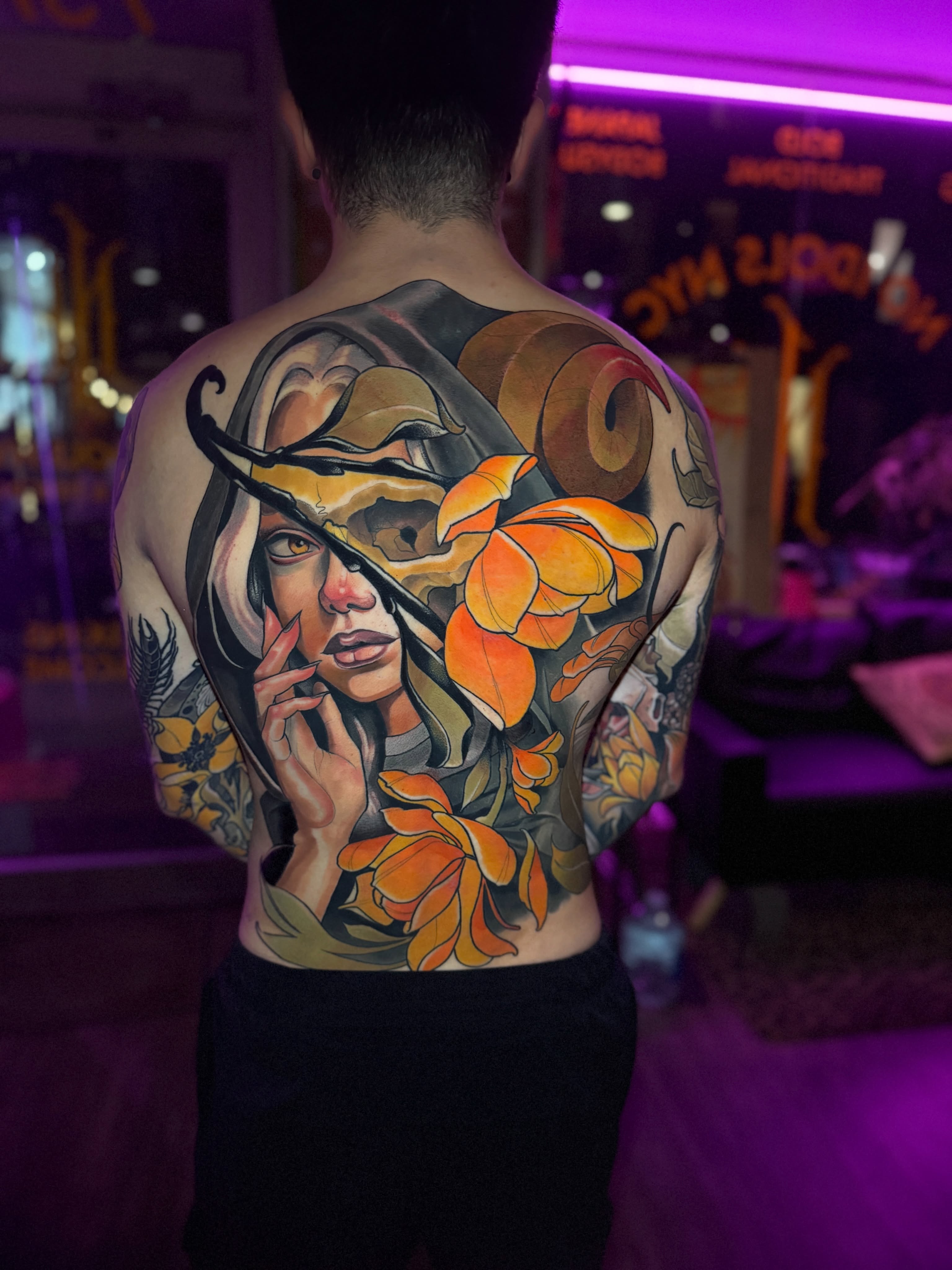 Woman with flowers realism tattoo on the back by Matt - Neotrad Tattoos, New York, New York