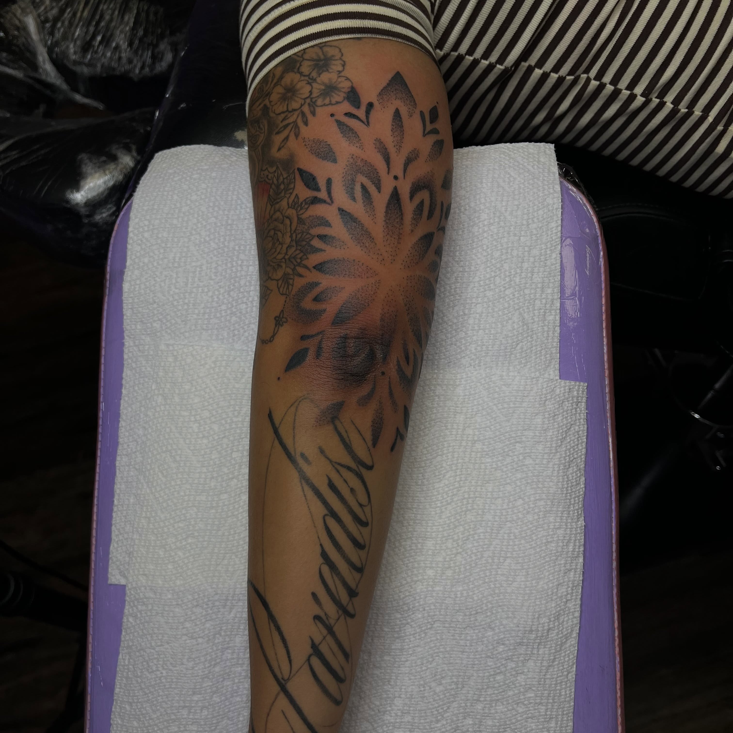 Floral design dotwork tattoo on the forearm by Ebony Robinson, Austintown, Ohio