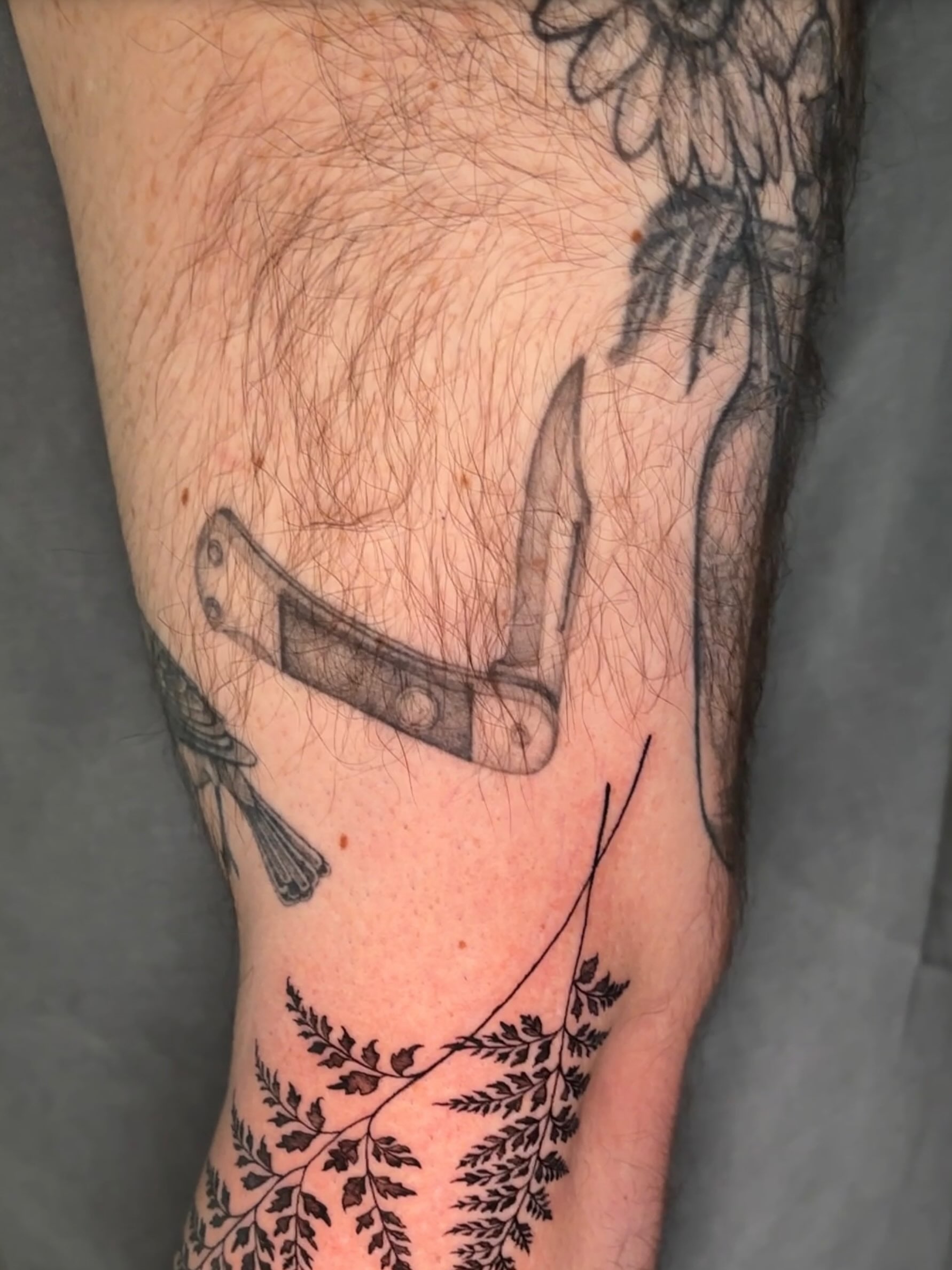 Anchor black and grey tattoo on the forearm by Emma Cotter