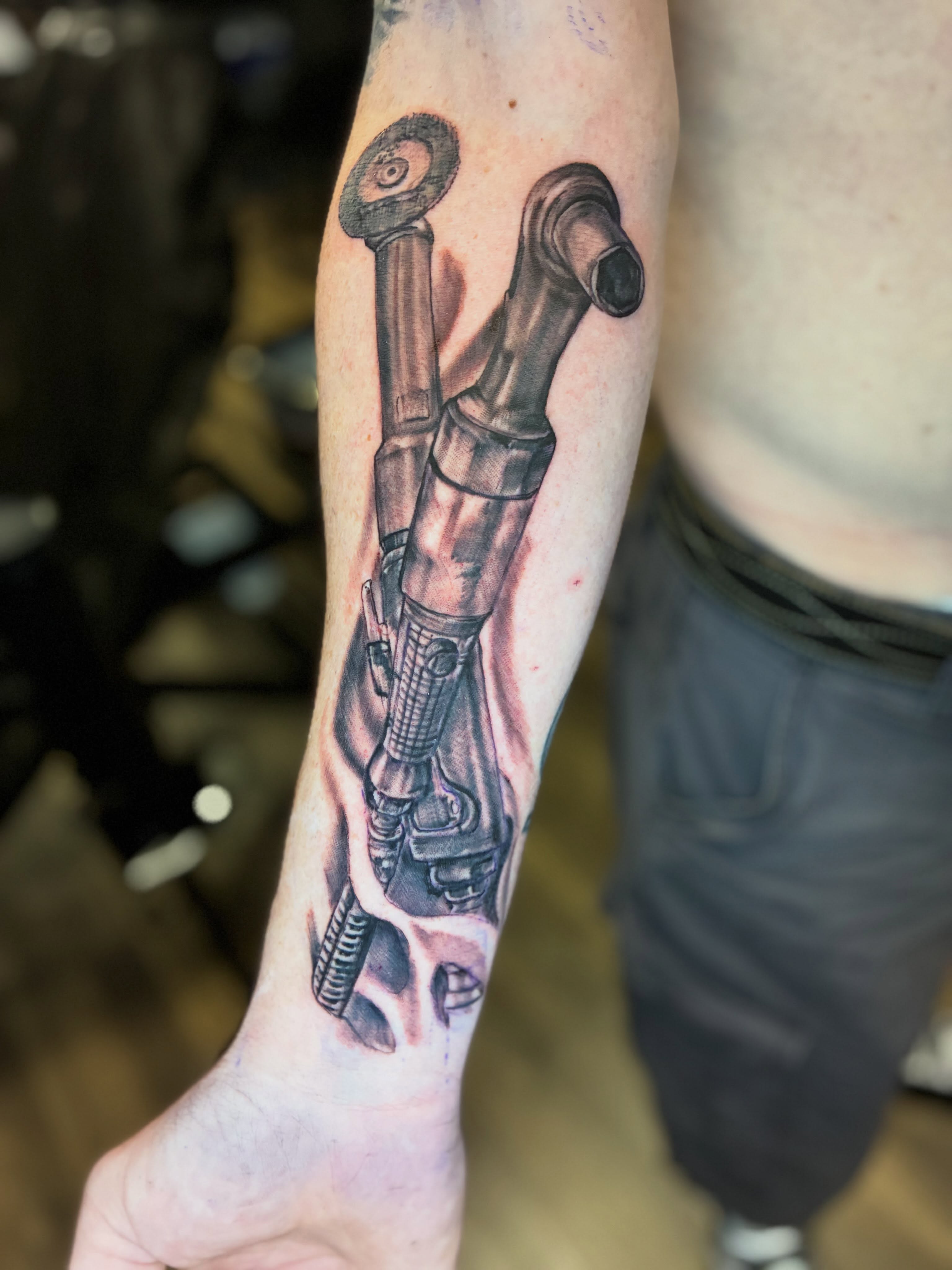 Mechanical arm realism tattoo on the forearm by Kevin Strong