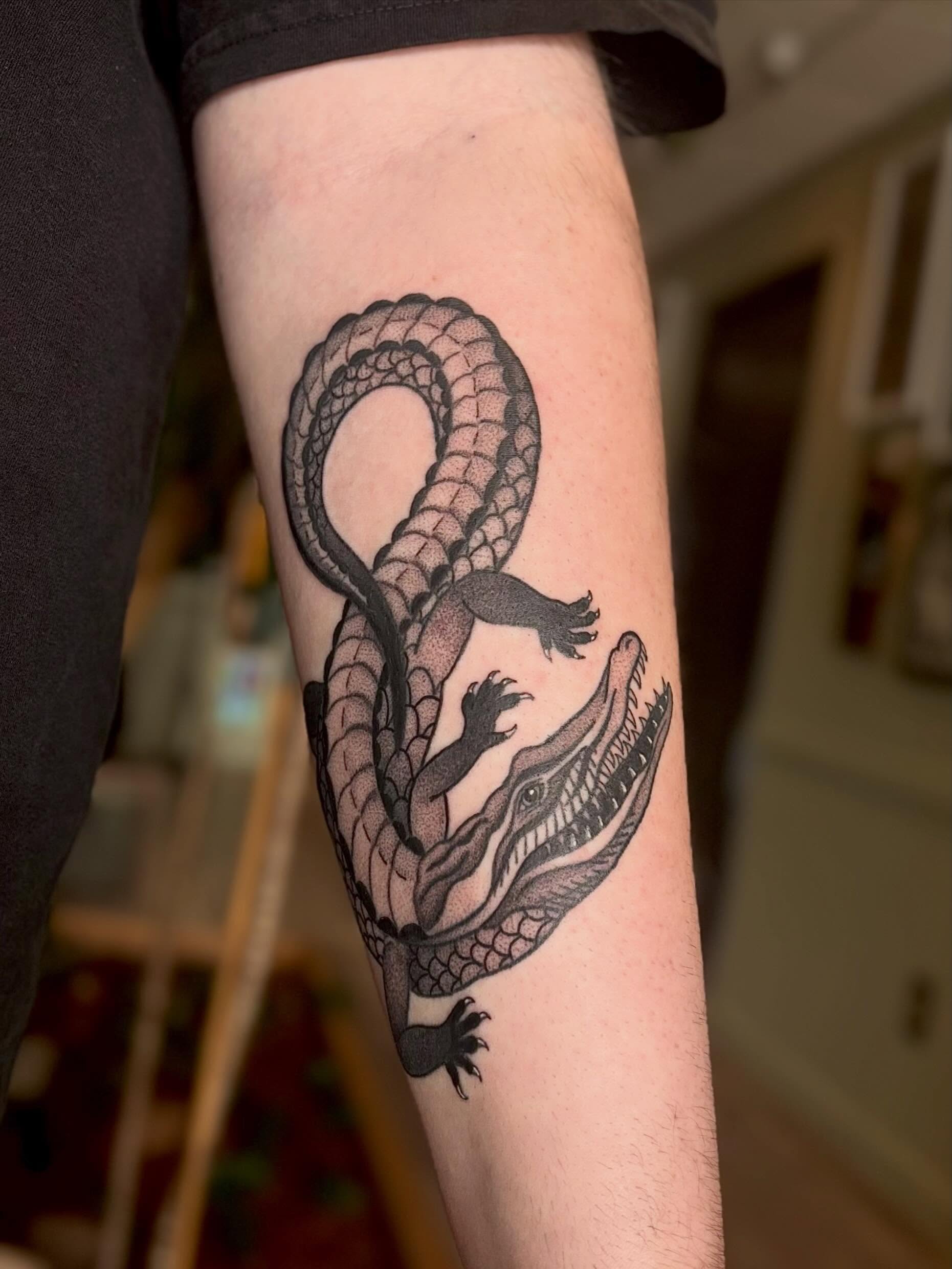 Alligator black and grey tattoo on the forearm by Erica McCullough