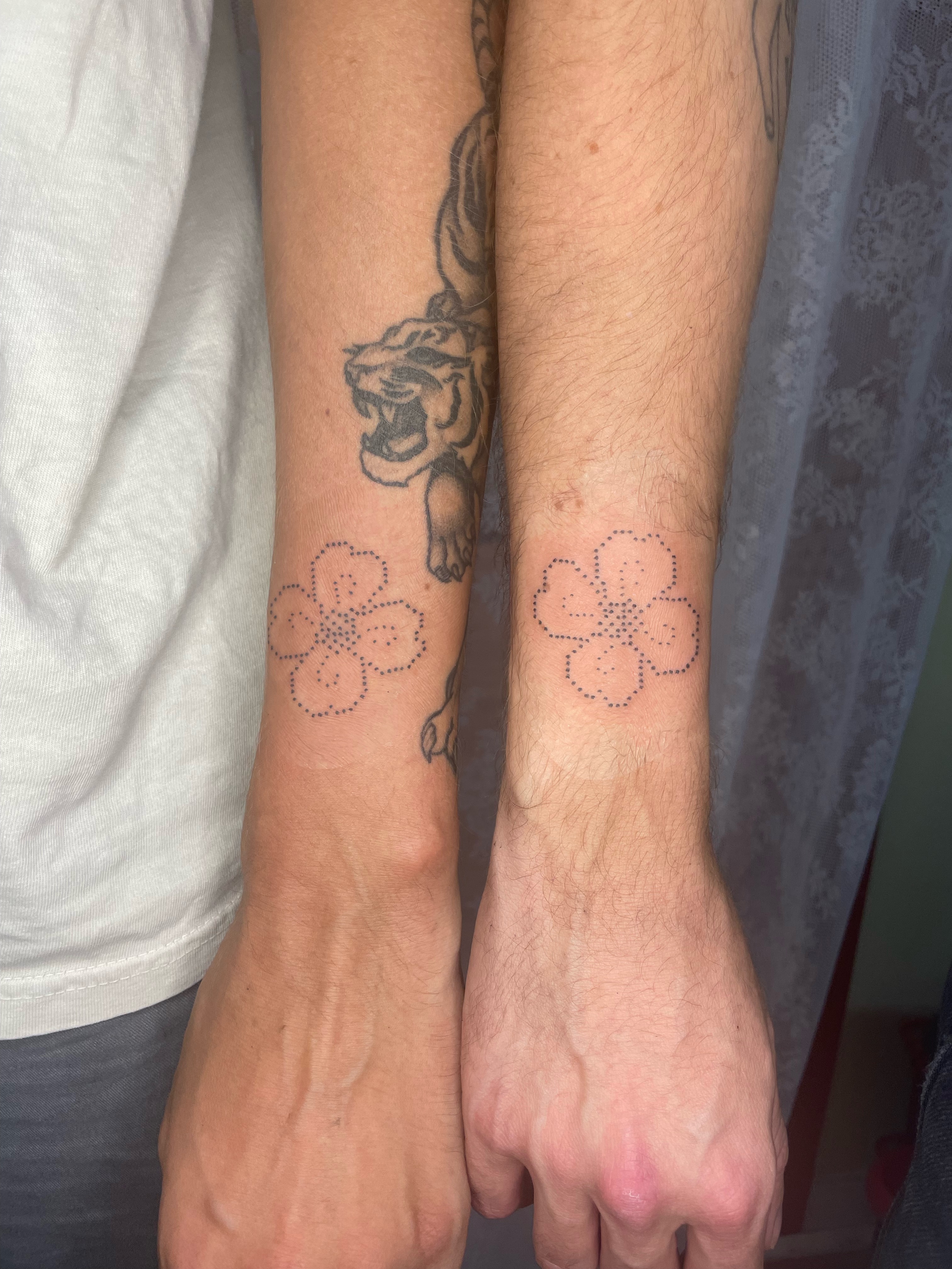 Cherry blossoms dotwork tattoo on the forearm by cait
