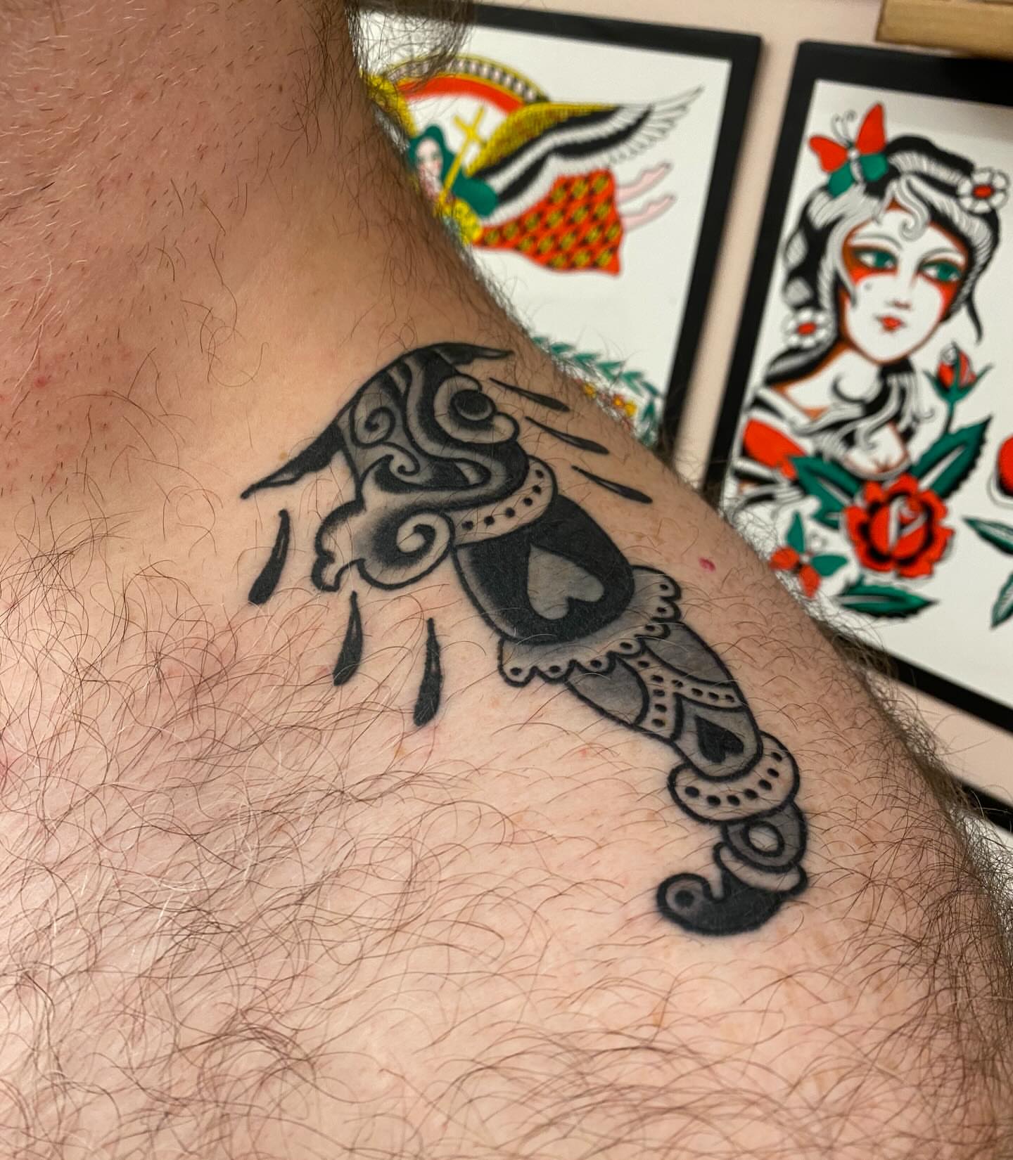 Mask American traditional tattoo on the chest by Abby Rose Estes