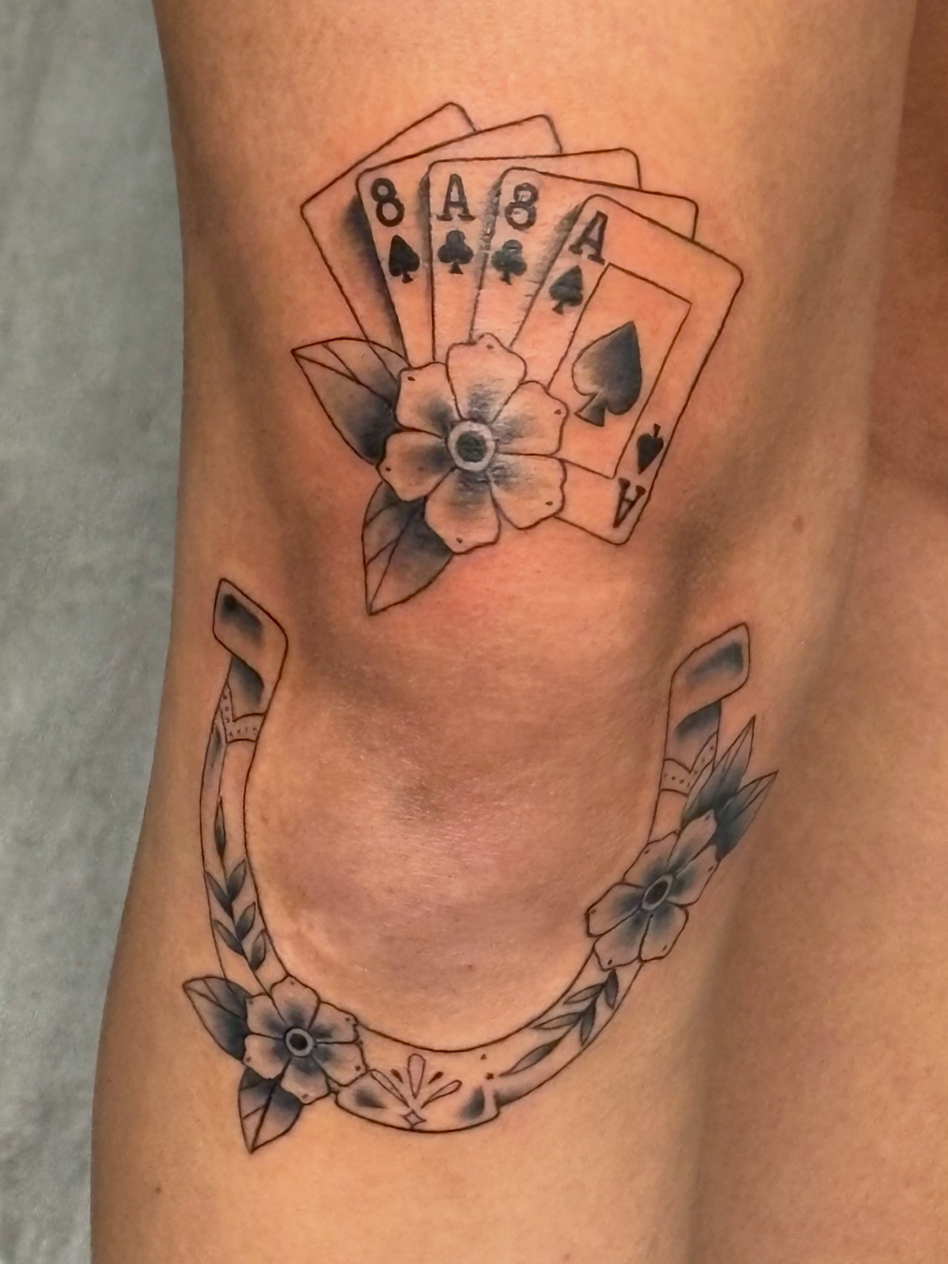 Playing cards and flower American traditional tattoo on the thigh by Andrea 🎨🖌