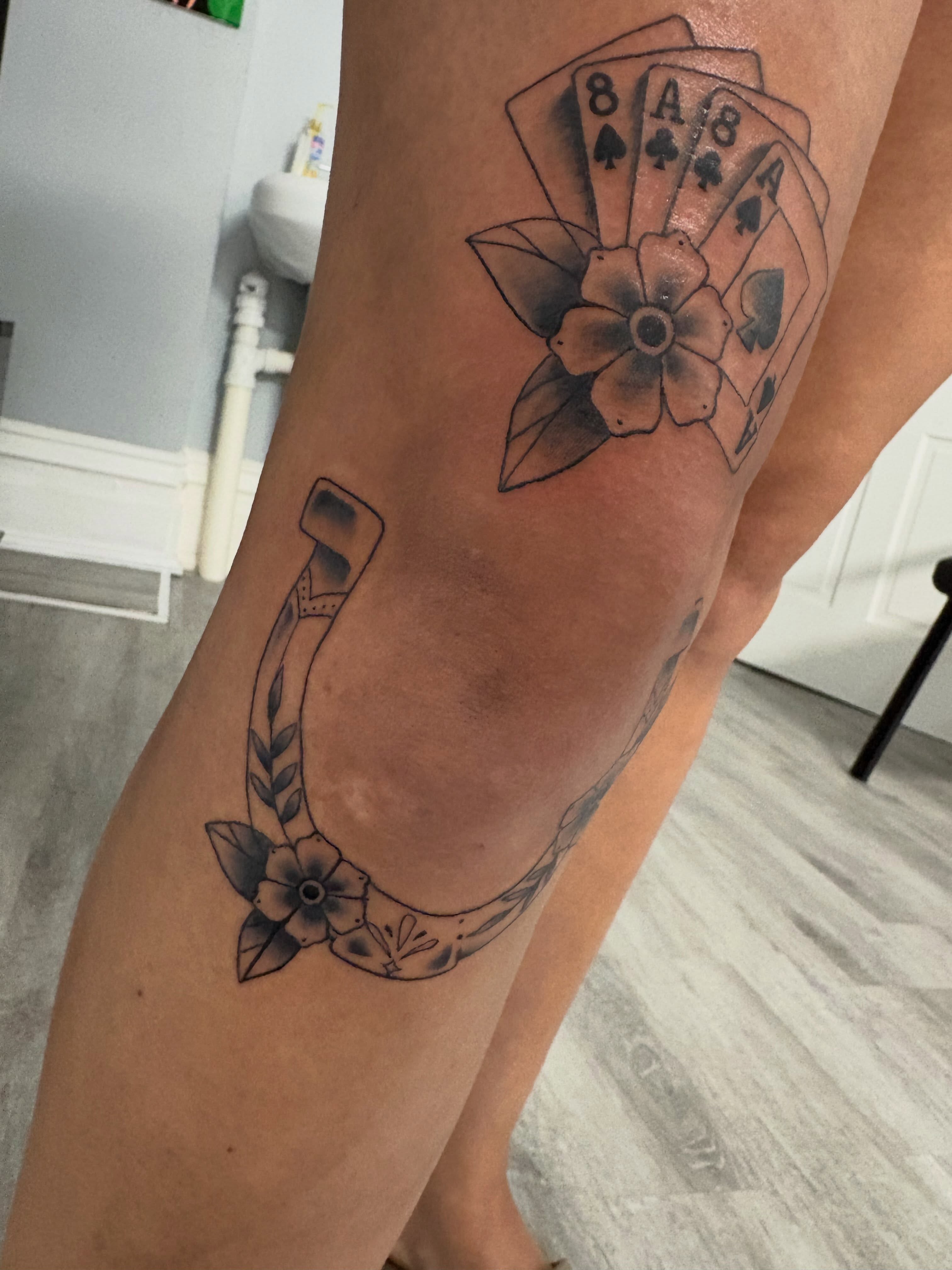 Playing cards and flowers black and grey tattoo on the forearm by Andrea 🎨🖌