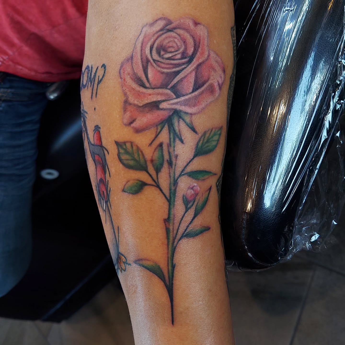 Rose realism tattoo on the forearm by Kari Rhoades, Marion, Iowa