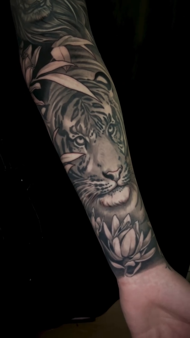 Tiger and lotus flowers realism tattoo by π‘πΆπΈπ½ππ ππΎππππ