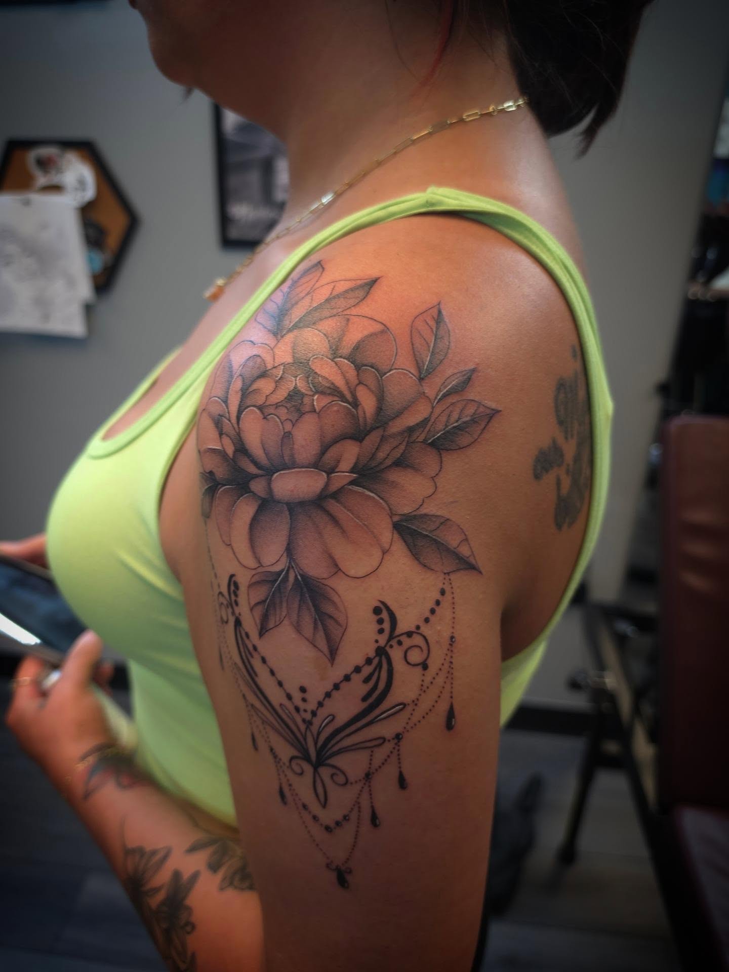 Floral design black and grey tattoo on the shoulder by Danielle Elizabeth