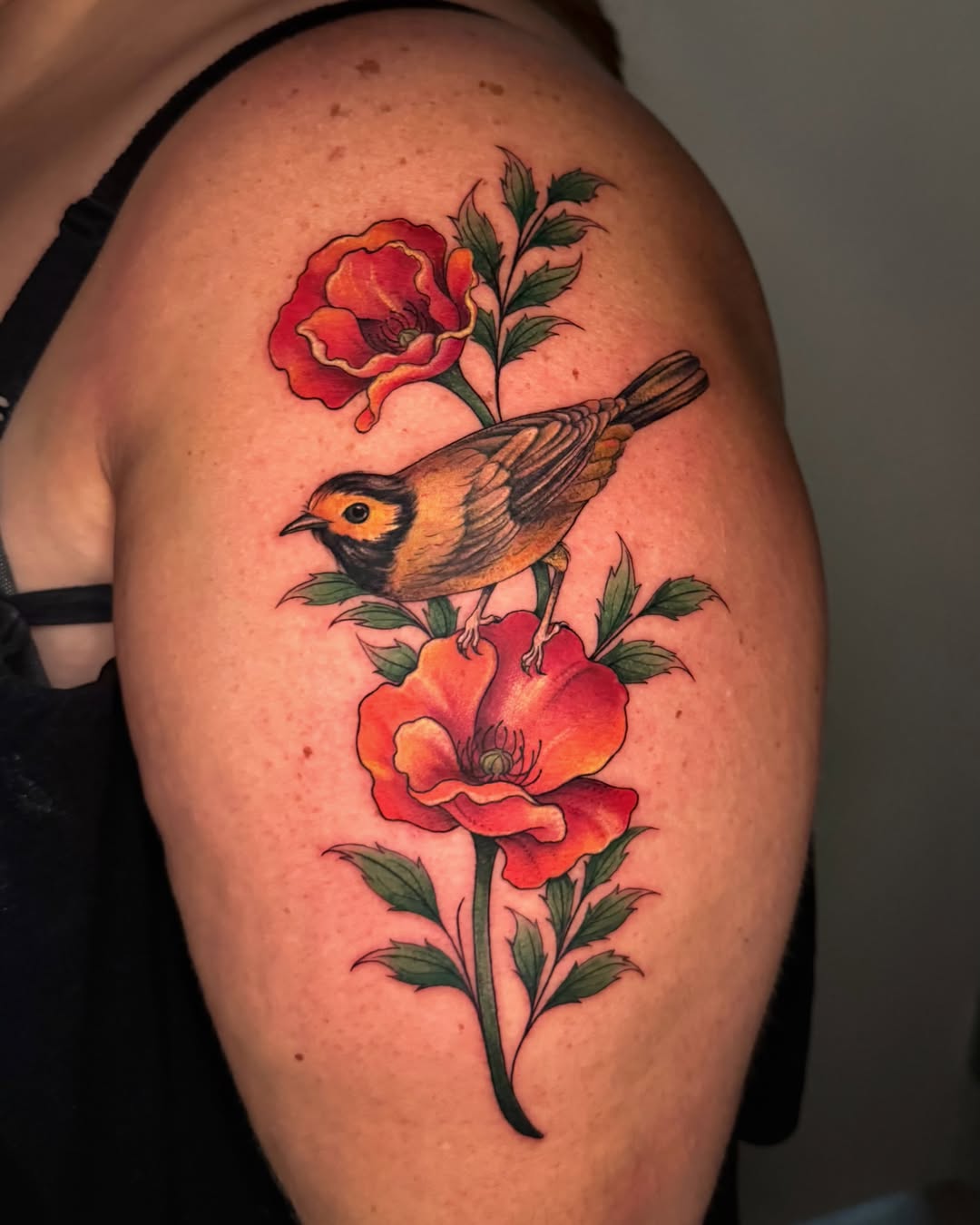 Bird and flowers realism tattoo on the shoulder by Nichole Lorence
