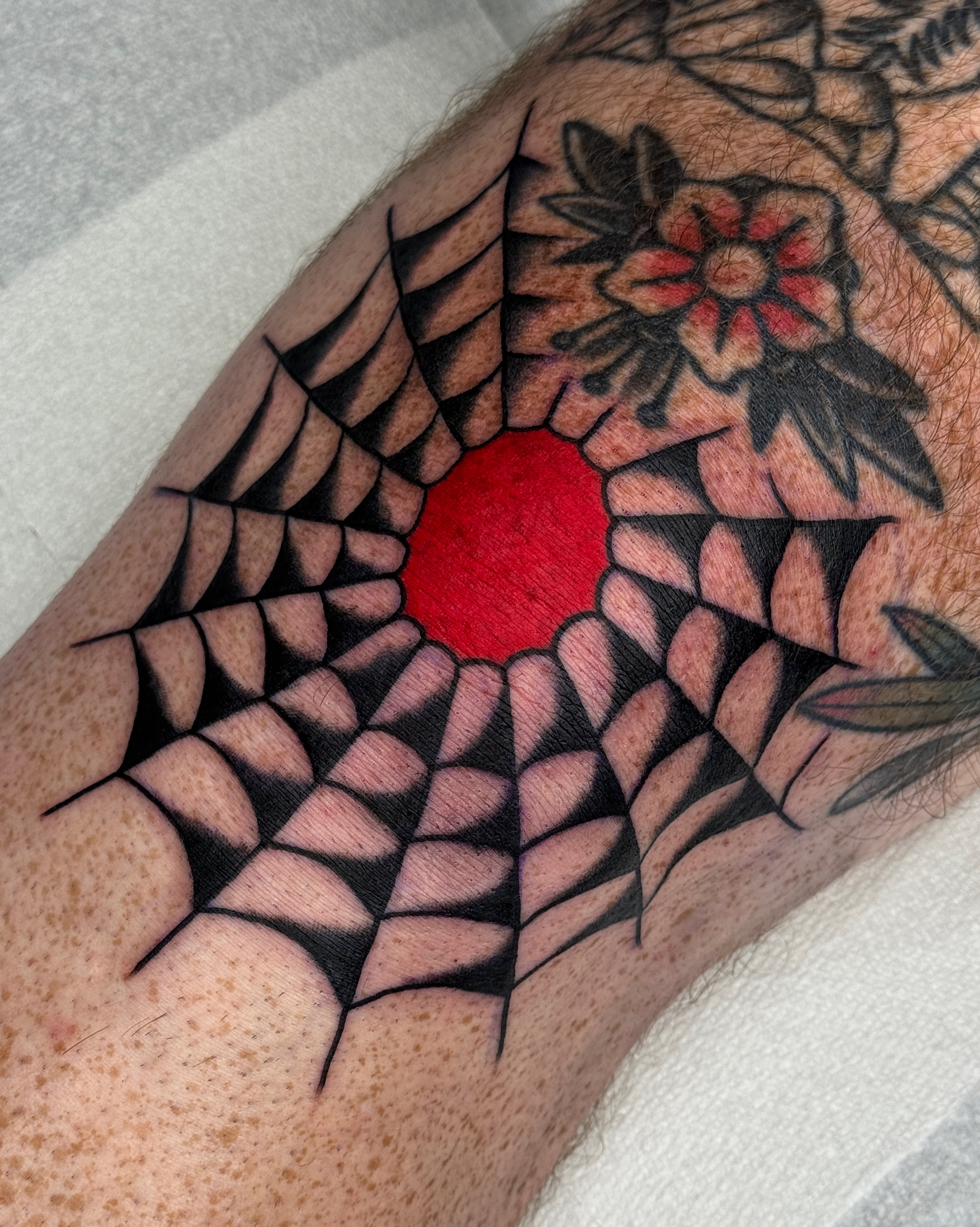 Geometric spiderweb geometric tattoo on the forearm by Bre Grover, Vancouver, British Columbia