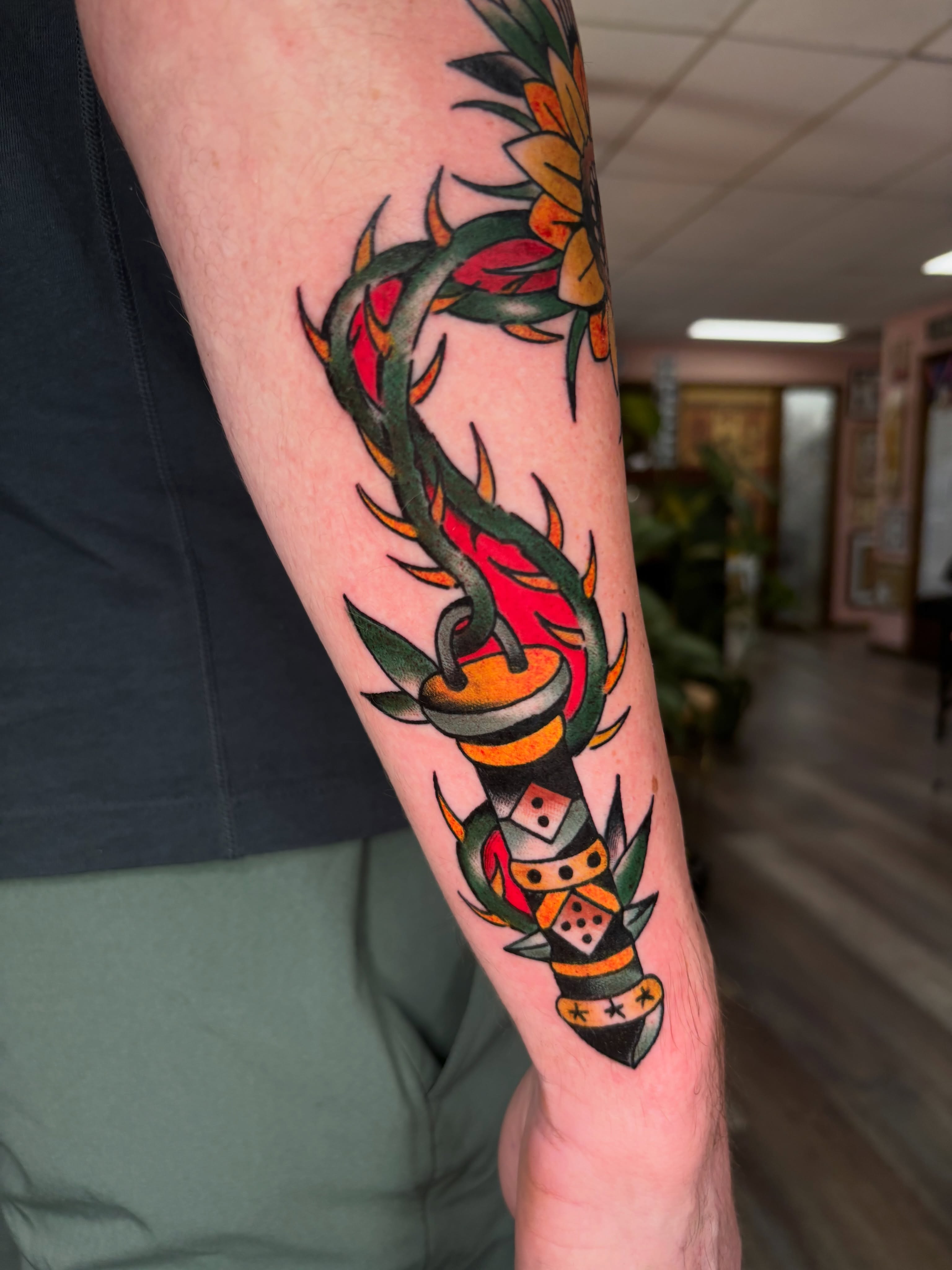 Torch and flame American traditional tattoo on the forearm by ericka bates