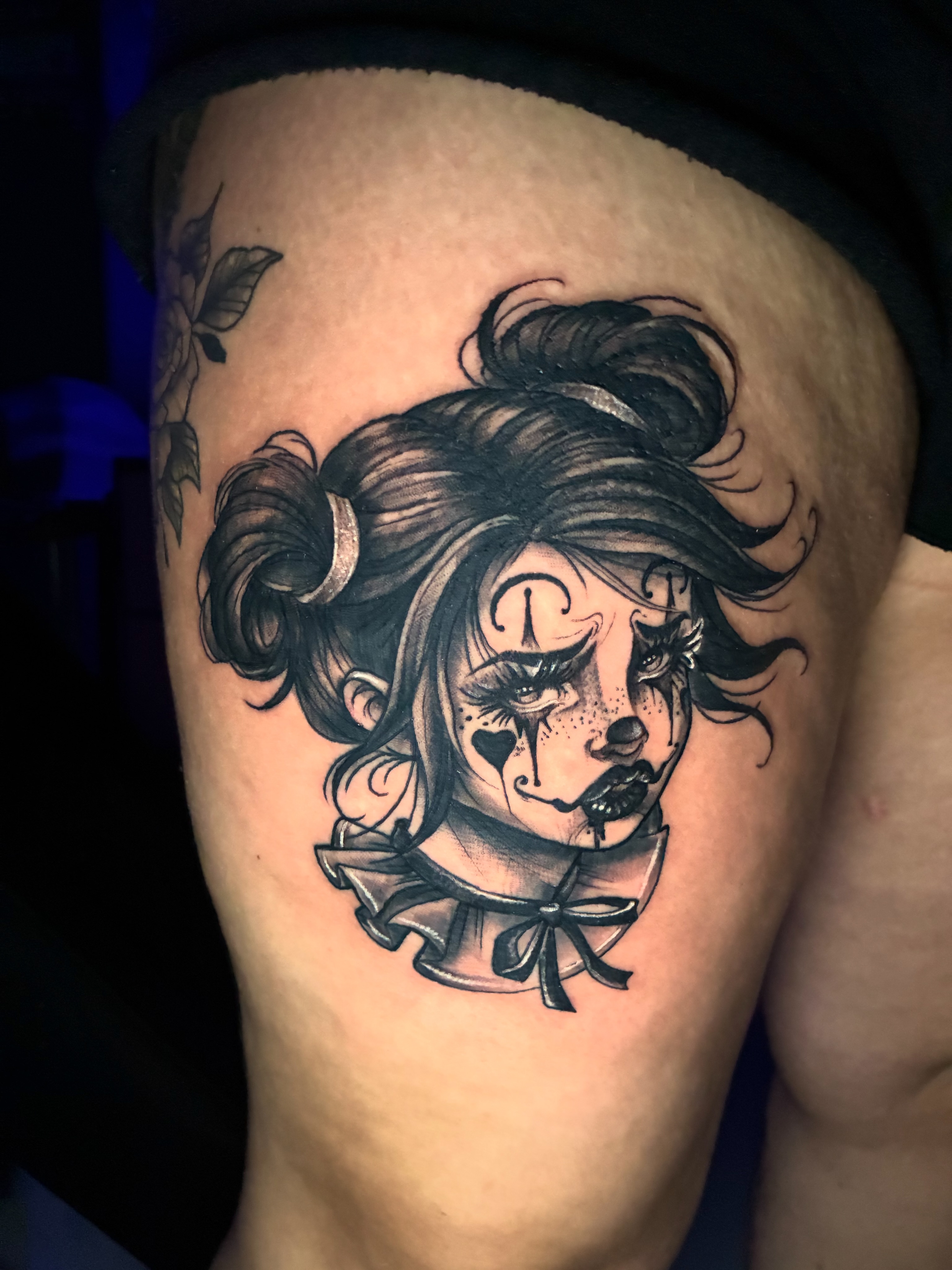 Doll realism tattoo on the thigh by Frank Miller