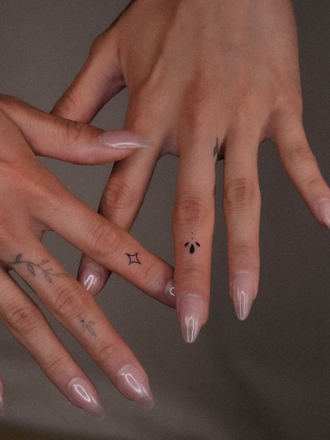 Star and teardrop dotwork tattoo on the hand by Joy Christiana
