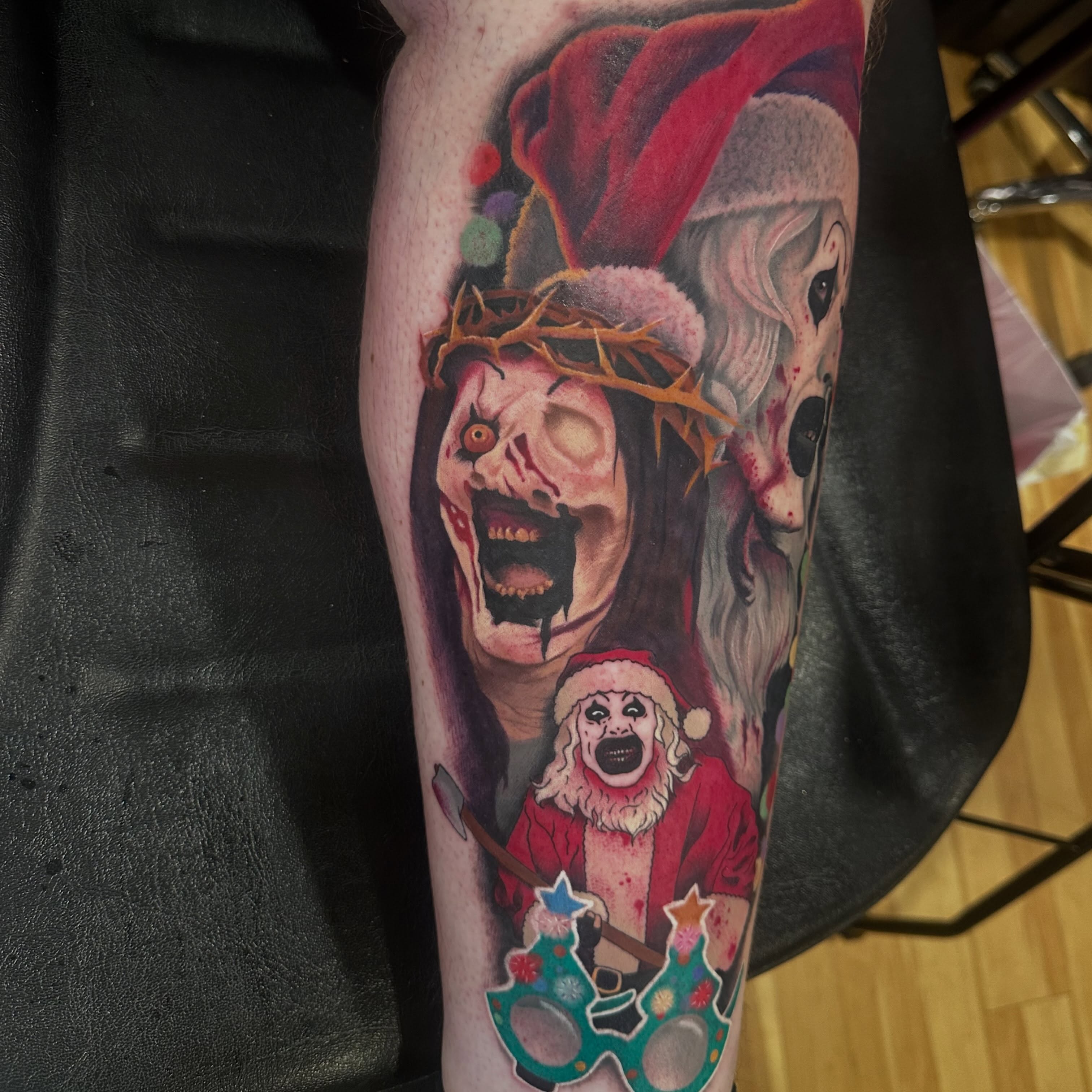 Horror-themed characters dark realism tattoo on the leg by Victoria Parsons, Clarksville, Indiana