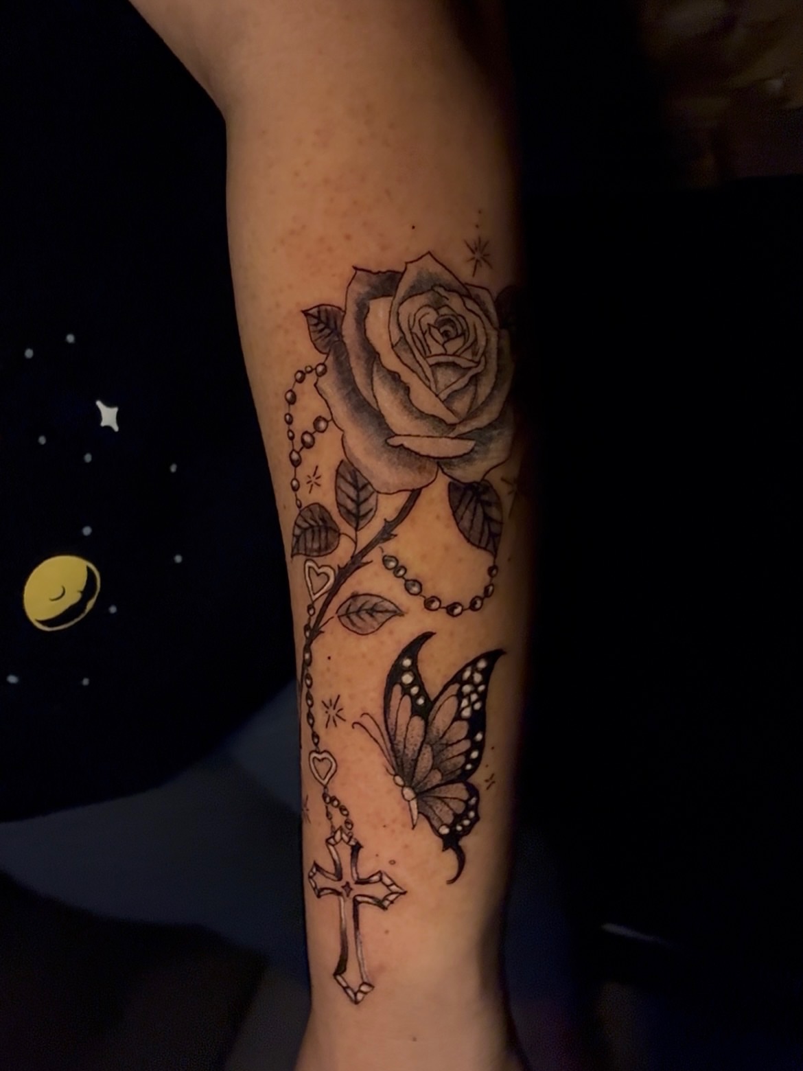 Rose and butterfly realism tattoo on the forearm by Tattzbyluma, Charlotte, North Carolina
