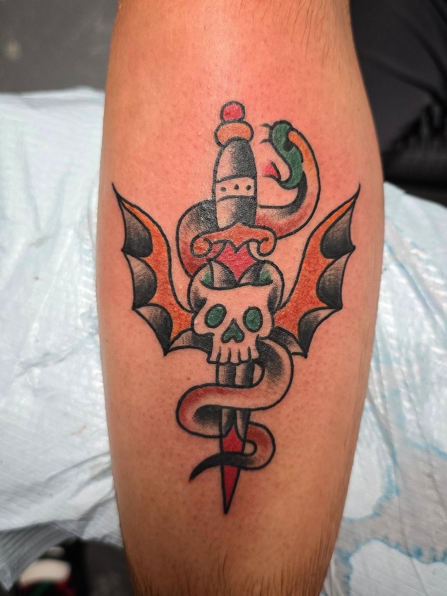 Bat and skull American traditional tattoo on the forearm by Andrea Lynne Hastings-Craven Tattoo Artist, Cleveland, Ohio