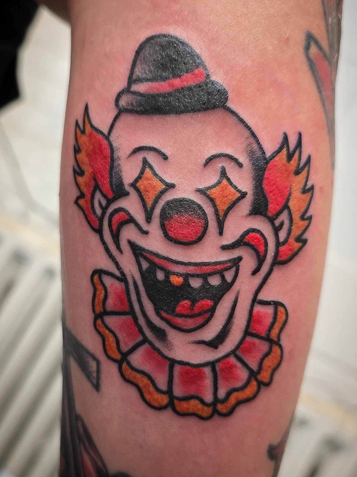 Clown American traditional tattoo on the forearm by Andrea Lynne Hastings-Craven Tattoo Artist, Cleveland, Ohio