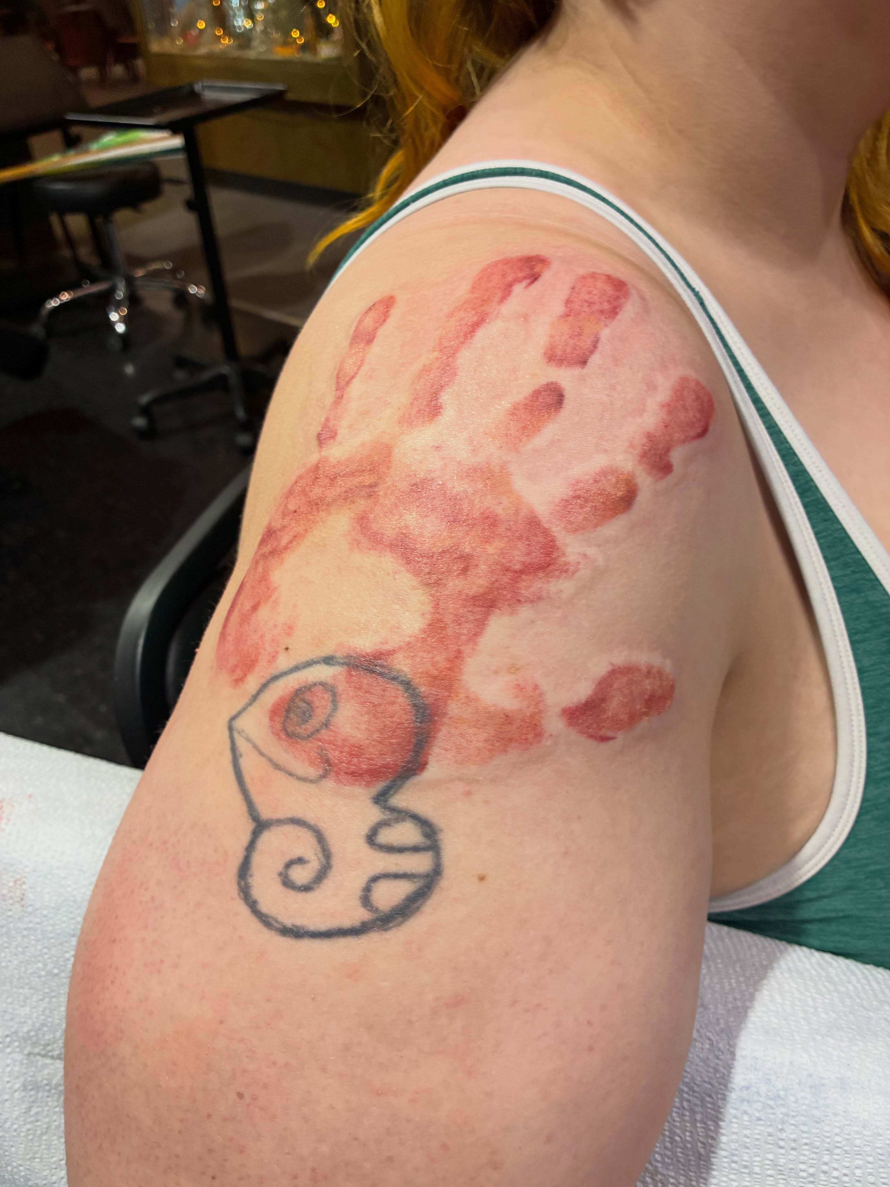 Handprint dotwork tattoo on the shoulder by Natalie Spuhler