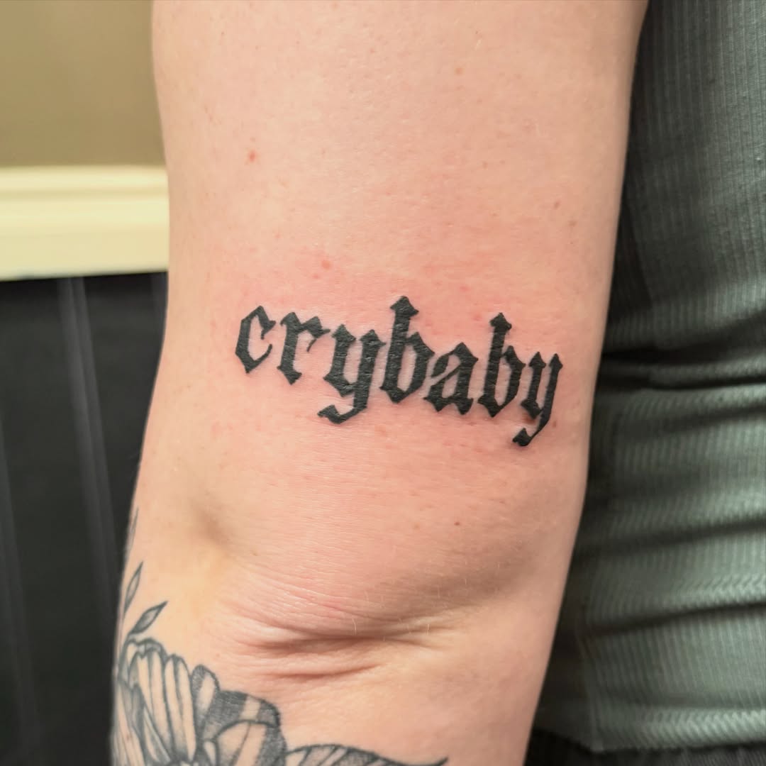 Crybaby lettering script tattoo on the forearm by Liz Glitz - Philadelphia Tattoo Artist