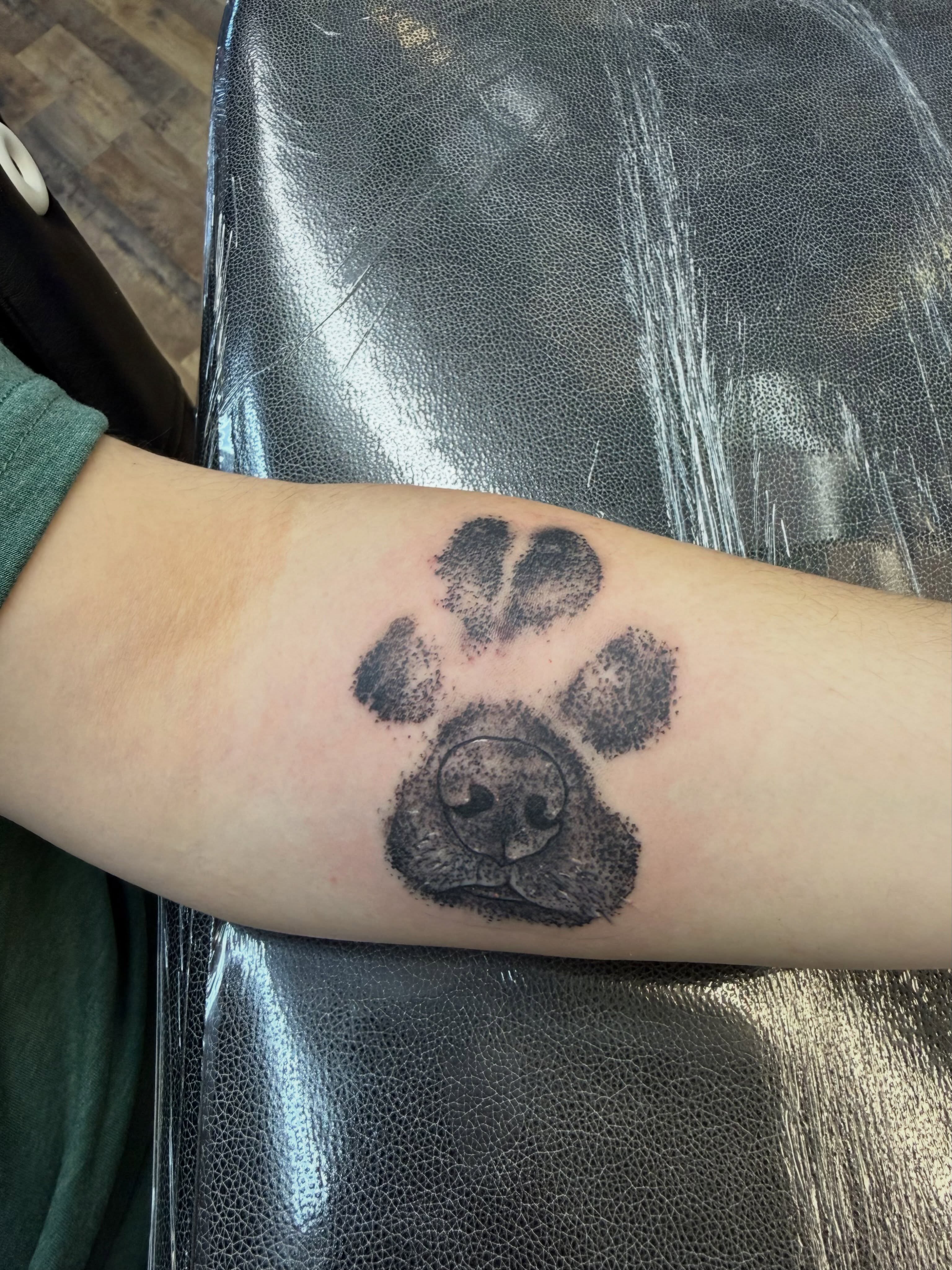 Dog paw print dotwork tattoo on the forearm by Josh Roberts, Franklin, Ohio