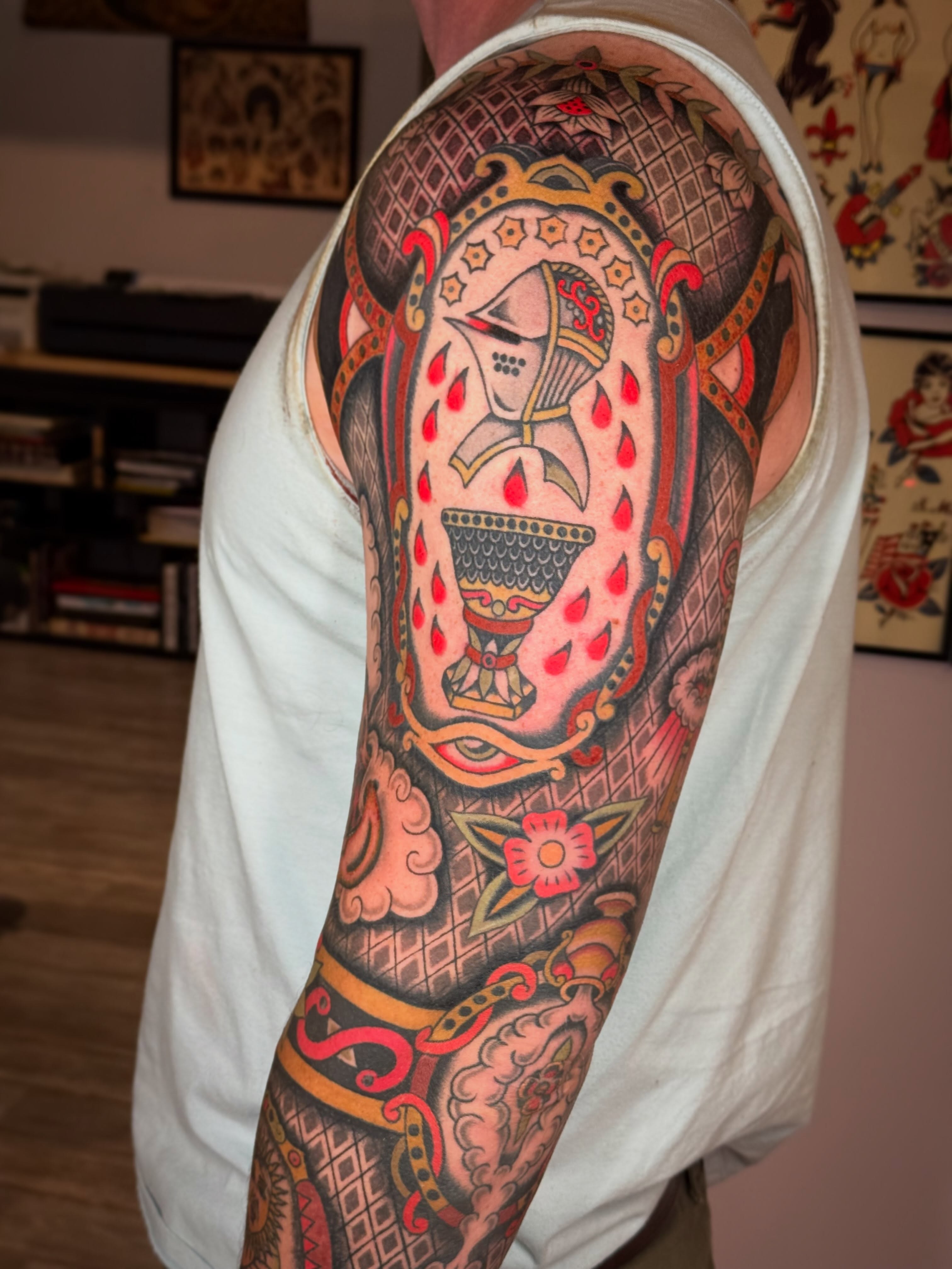 Playing card American traditional tattoo on the upper arm by Collin Rigsby, Minneapolis, Minnesota