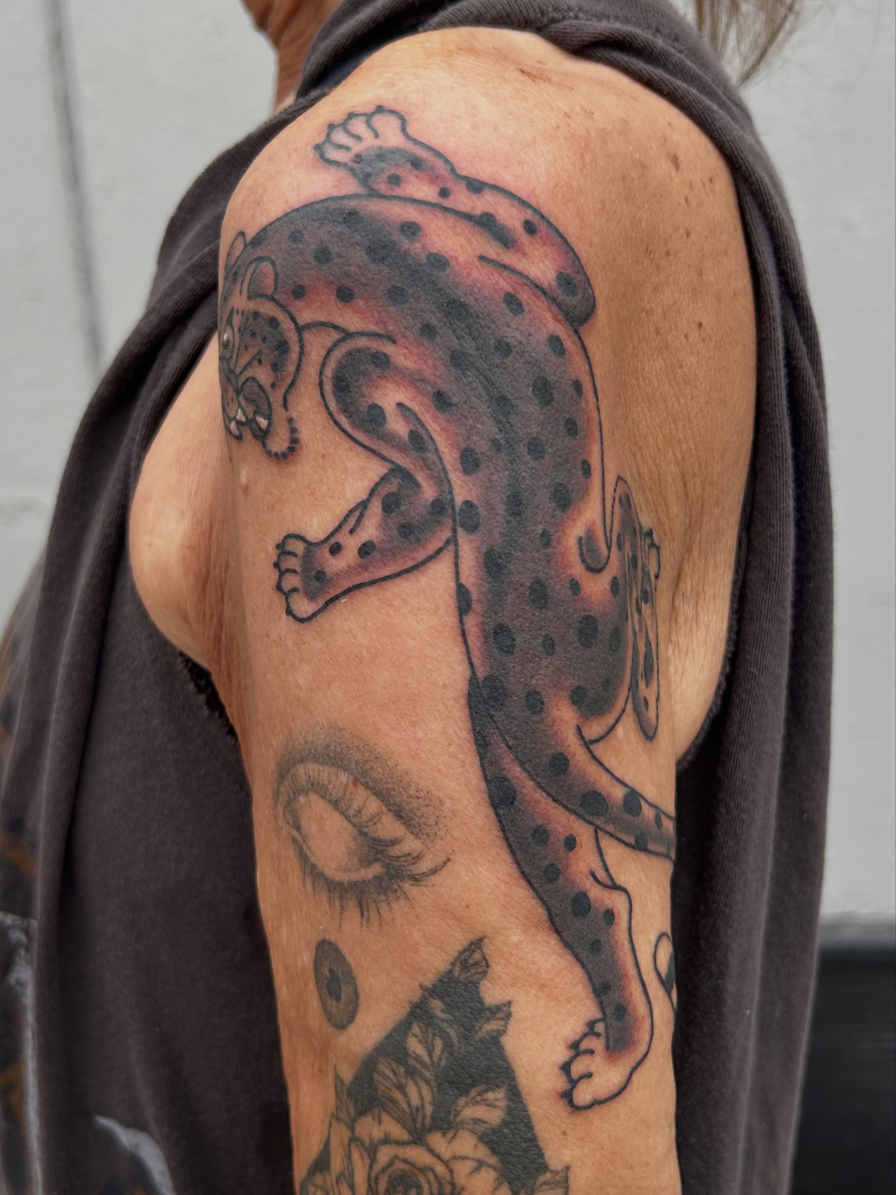 Leopard dotwork tattoo on the shoulder by Lauren Alexandra