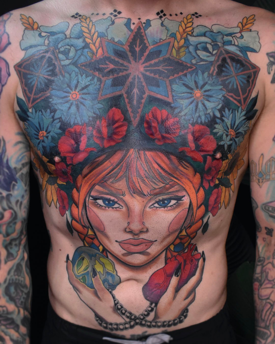Woman with flowers American traditional tattoo on the chest by Erin Isaacs