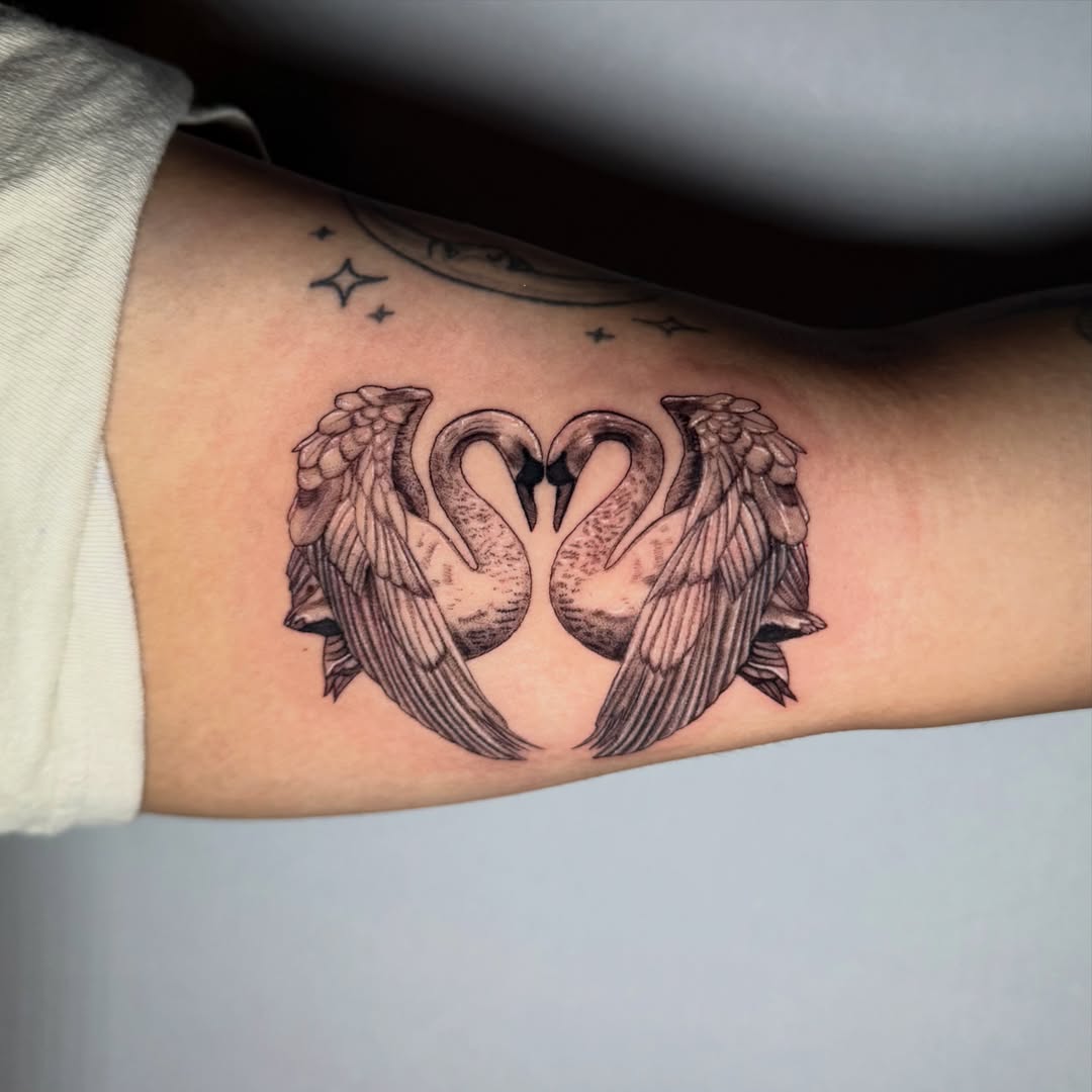 Swans forming heart black and grey tattoo on the forearm by 𝖎𝖘𝖆 ✶ 𝖉𝖋𝖜 𝖙𝖆𝖙𝖙𝖔𝖔𝖘