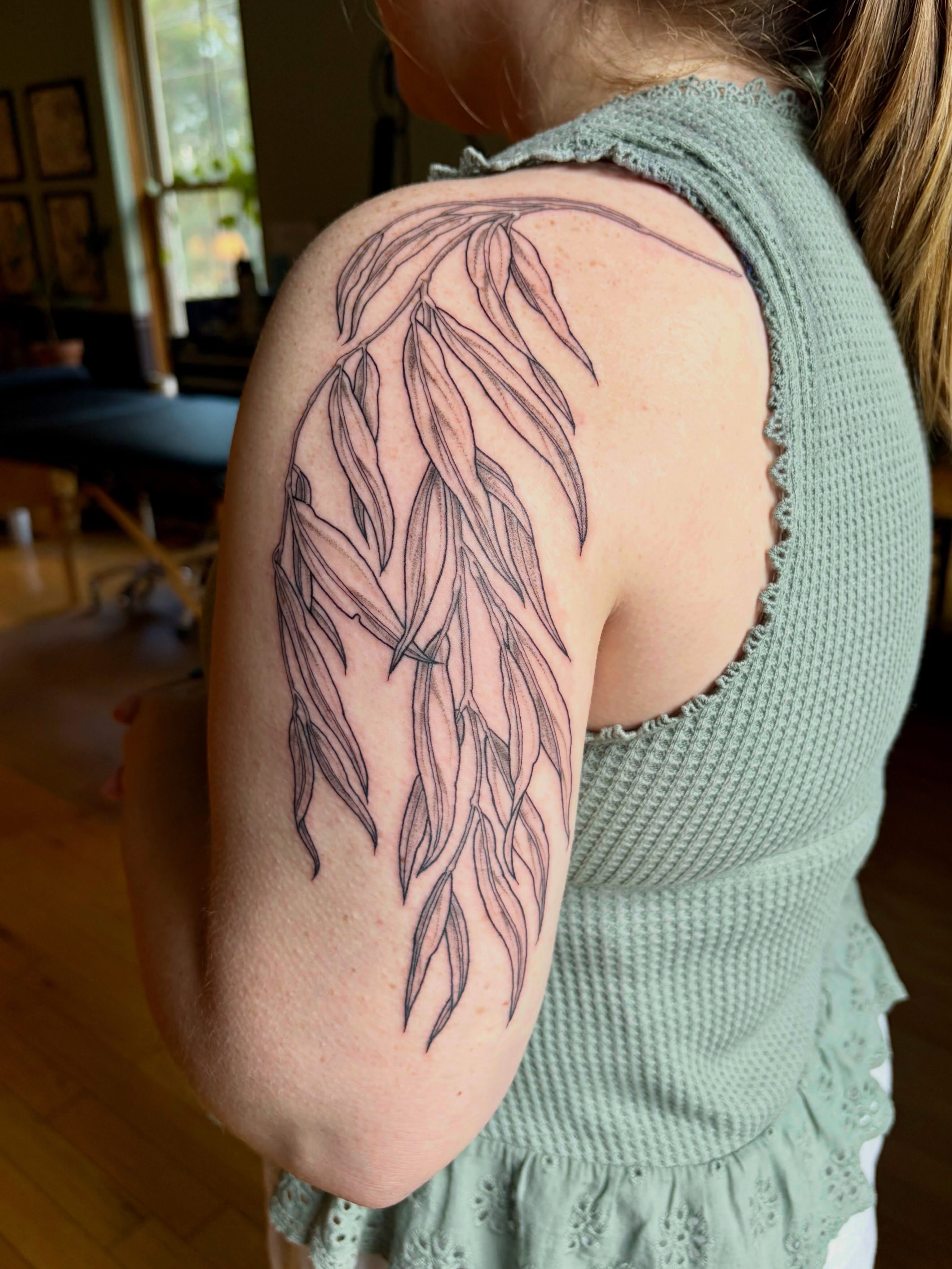 Weeping willow branches black and grey tattoo on the shoulder by Sarah Roach