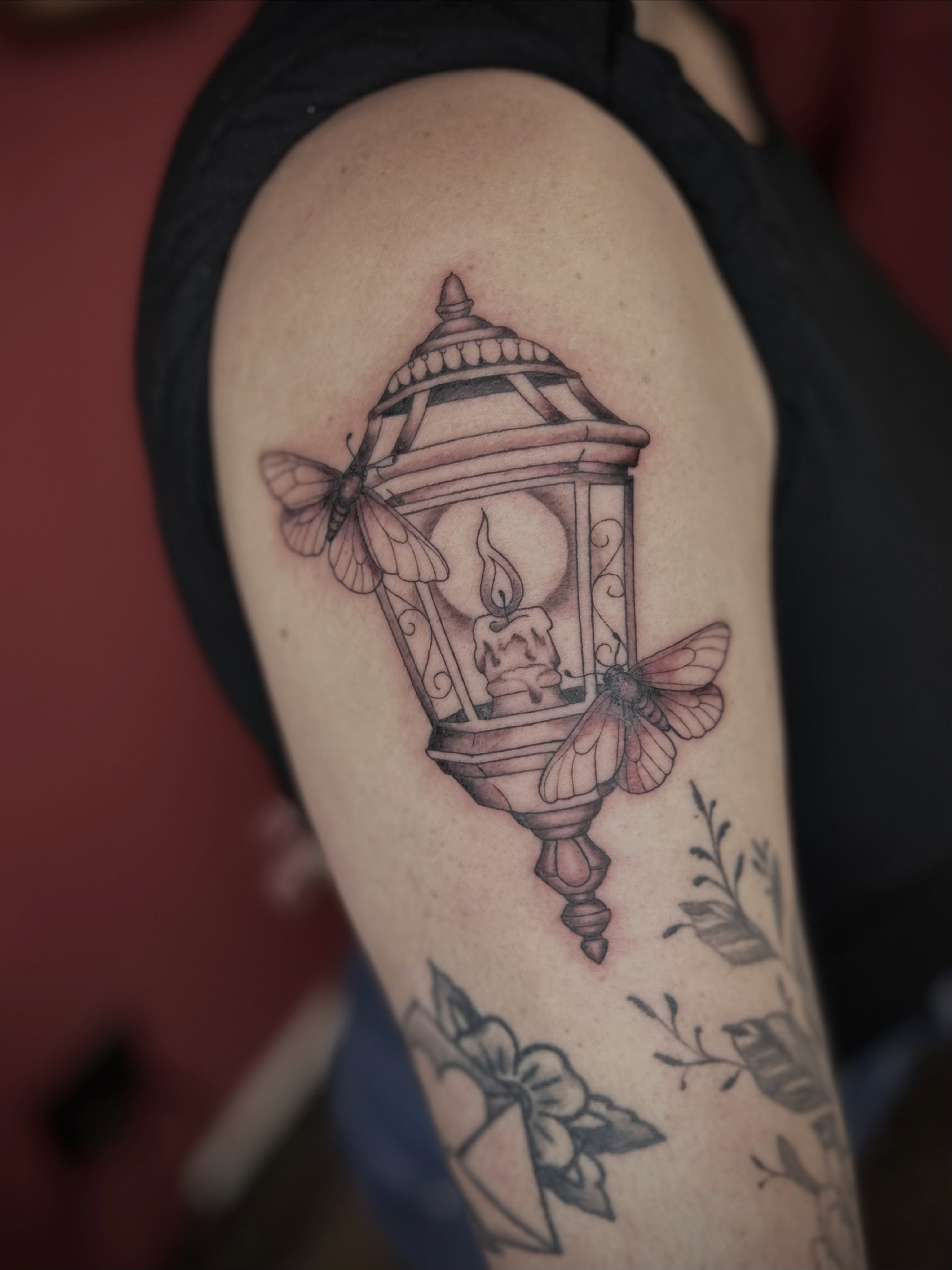 Lantern with moth black and grey tattoo on the forearm by Lexi Rose