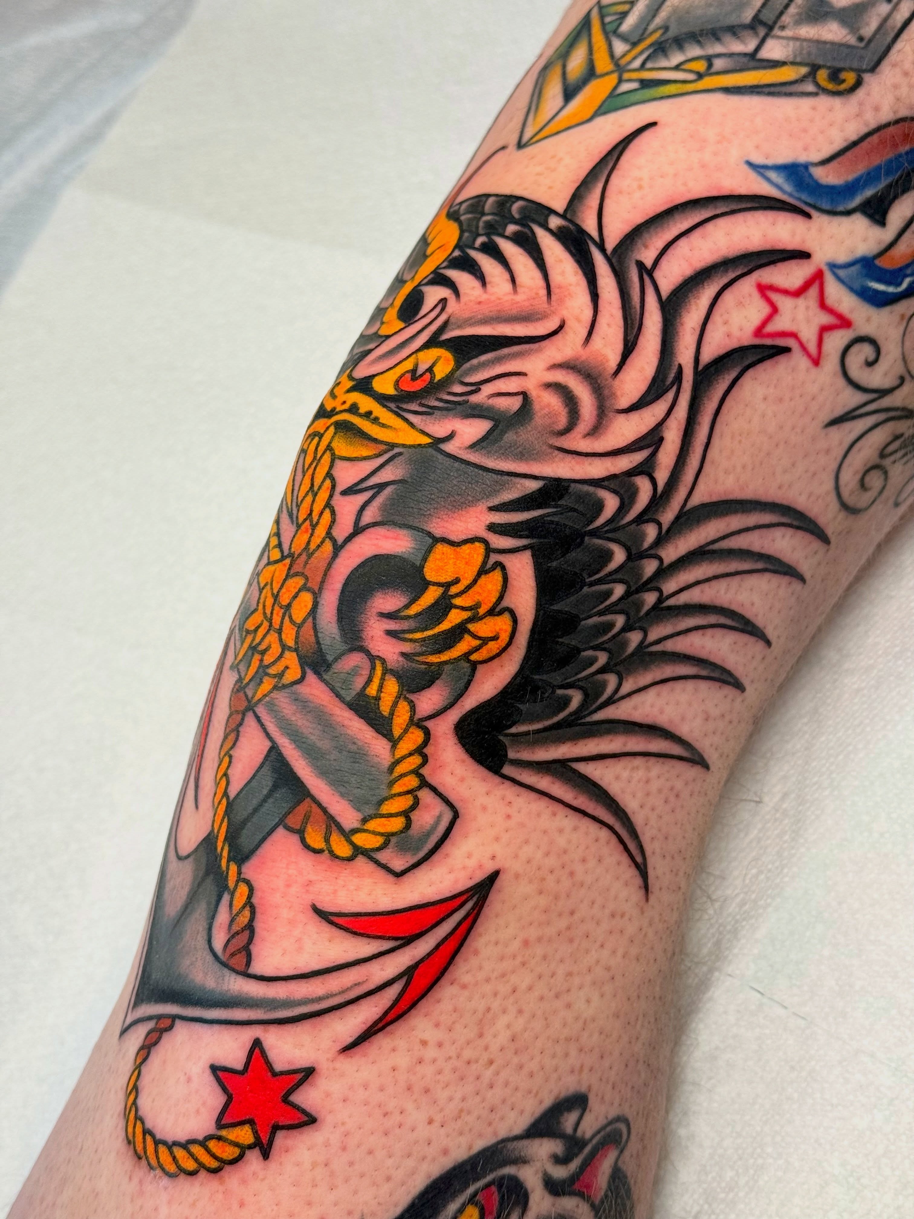 Anchor and dragon American traditional tattoo on the forearm by sydtatz