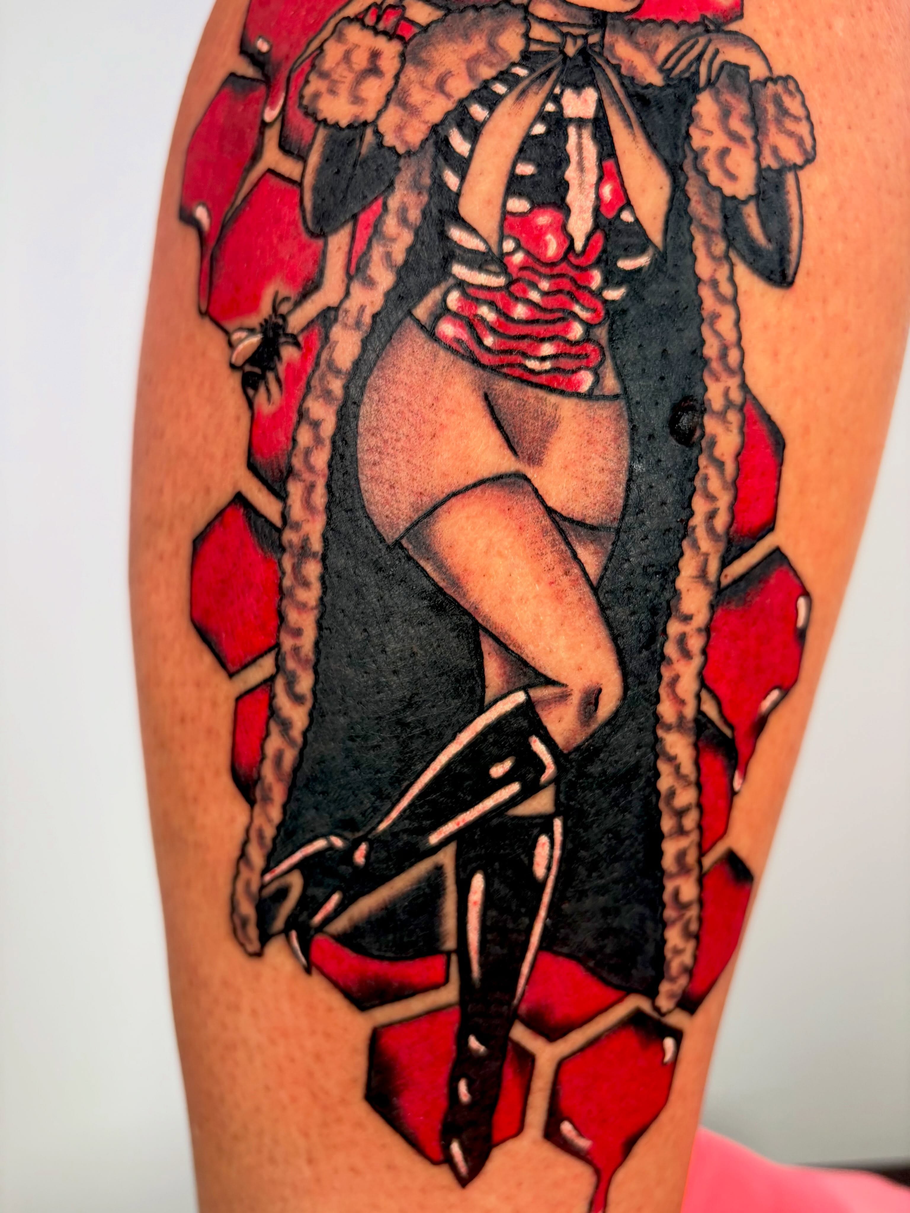 Pin-up girl American traditional tattoo on the thigh by Lorelei