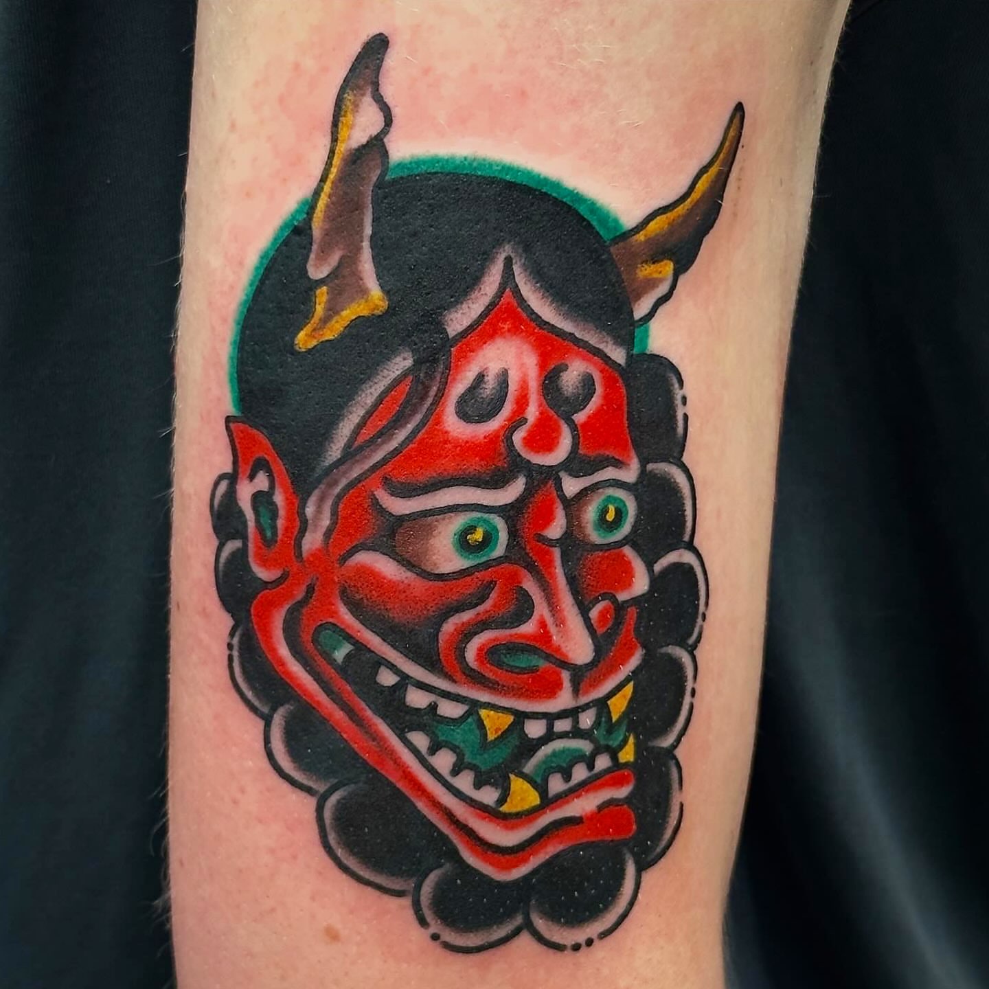 Demon mask American traditional tattoo on the forearm by Jared Allen, Saint Petersburg, Florida