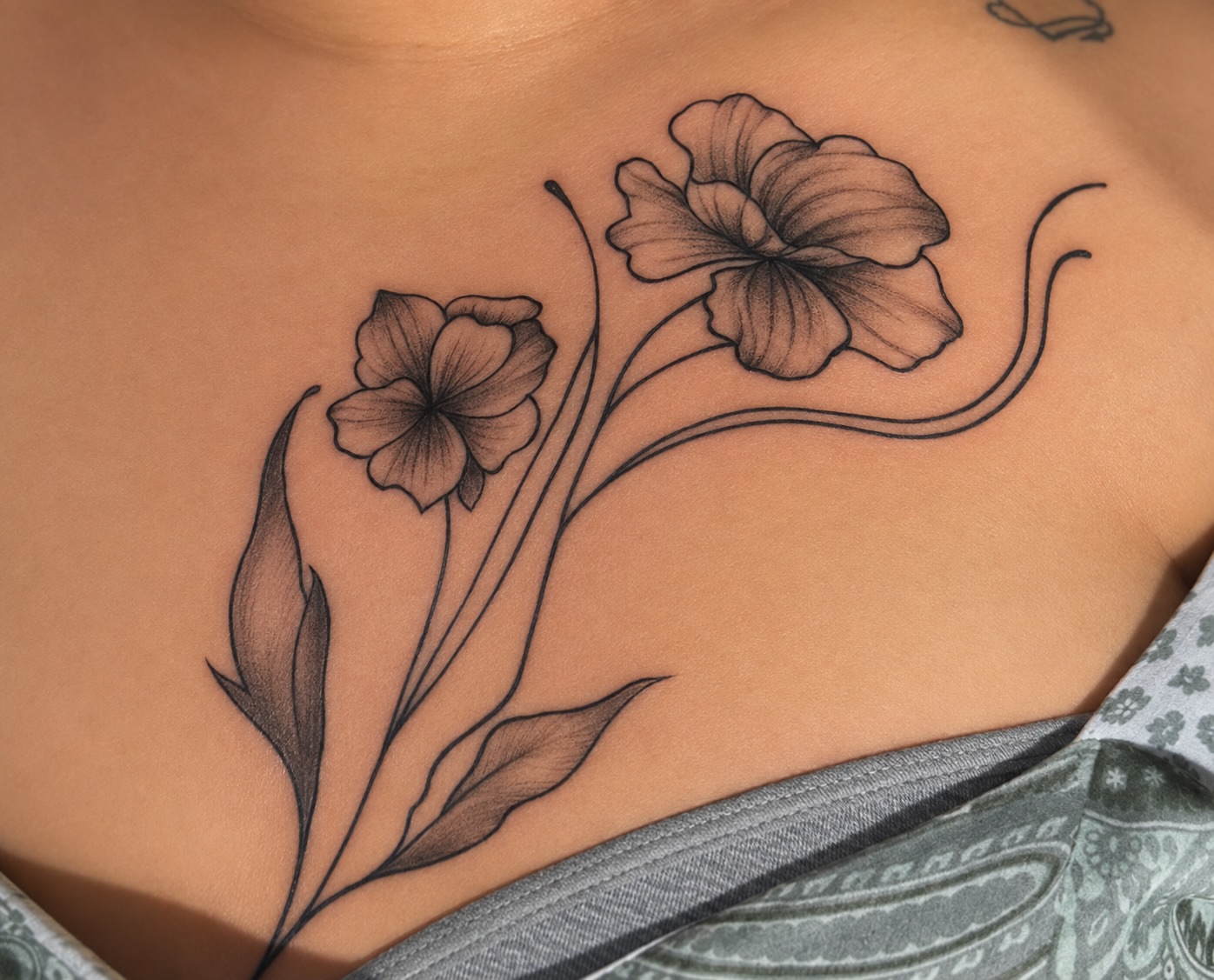 Flowers black and grey tattoo on the chest by @tatzbythadon