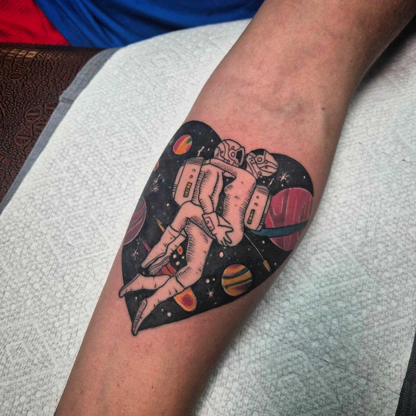 Astronaut in space new school tattoo on the forearm by Taylor Popkins