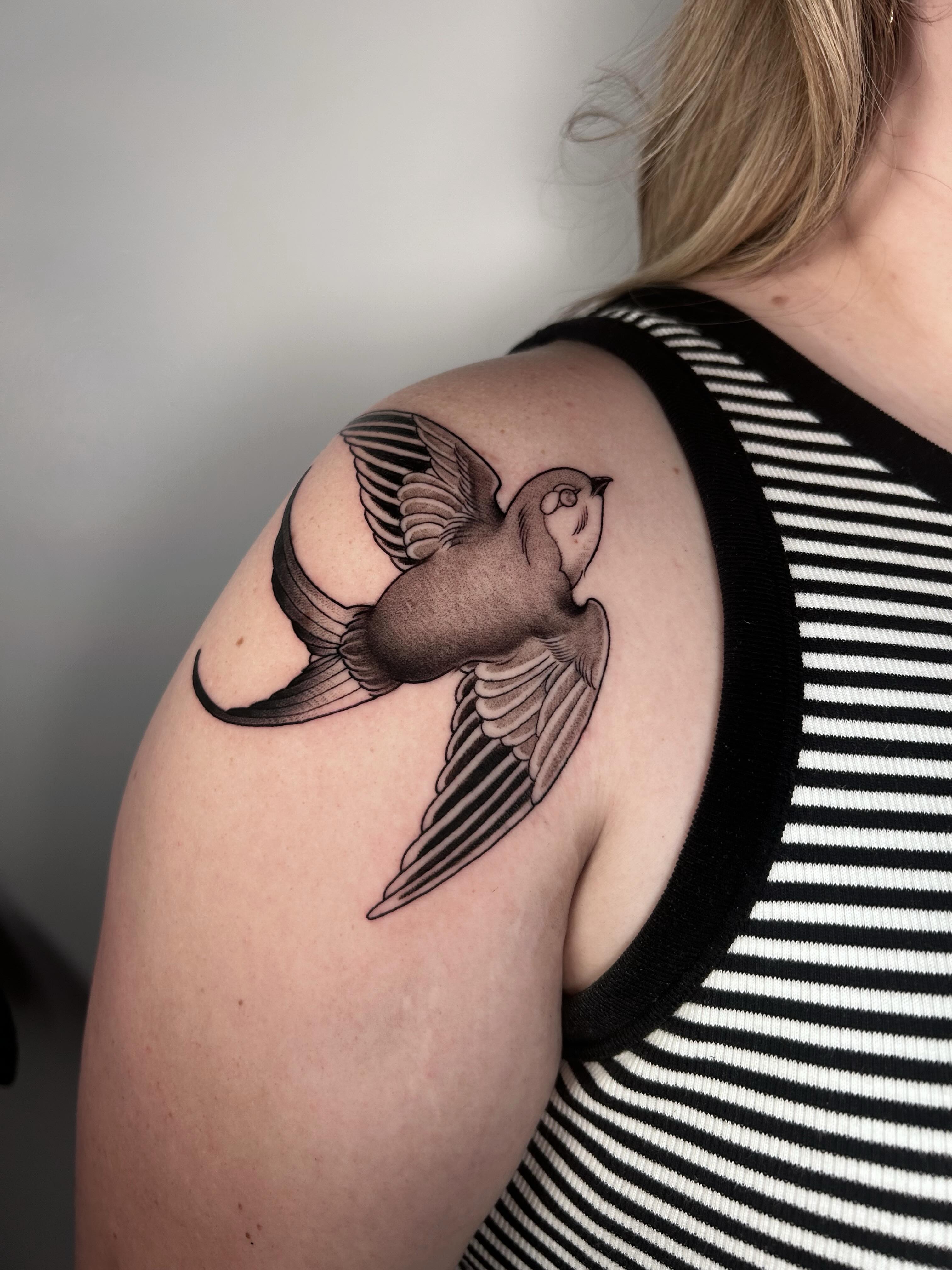 Swallow American traditional tattoo on the shoulder by Salt Lake City tattoo artist